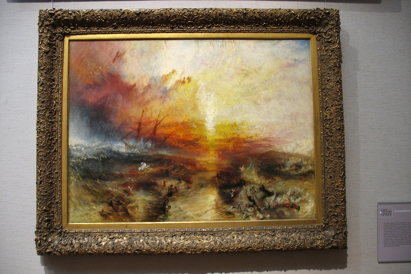 kırmızı sarı renklerin baskın olduğu bir tablo belli belirsiz bir gemi ve birkaç silüet var