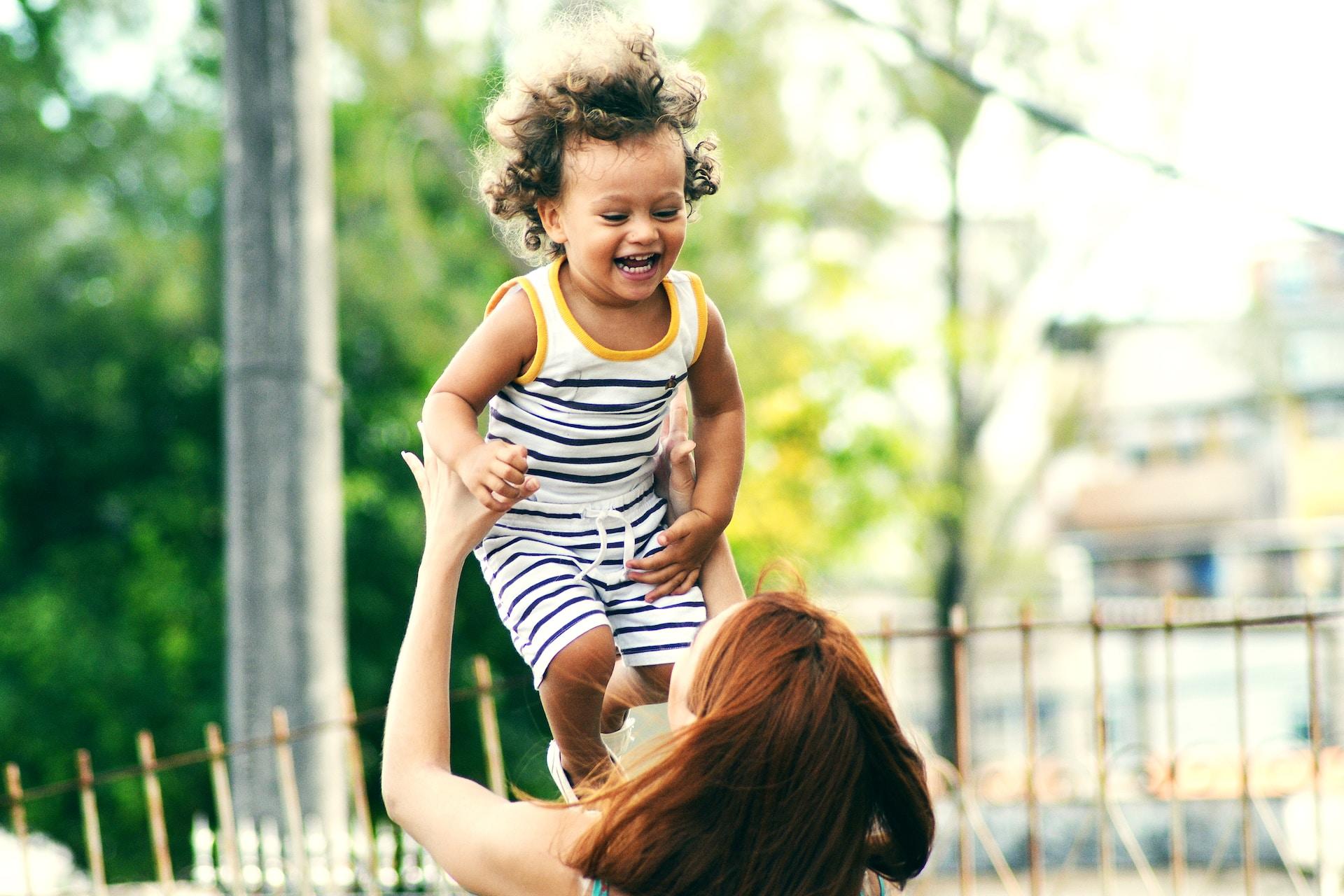 a happy child with a mum