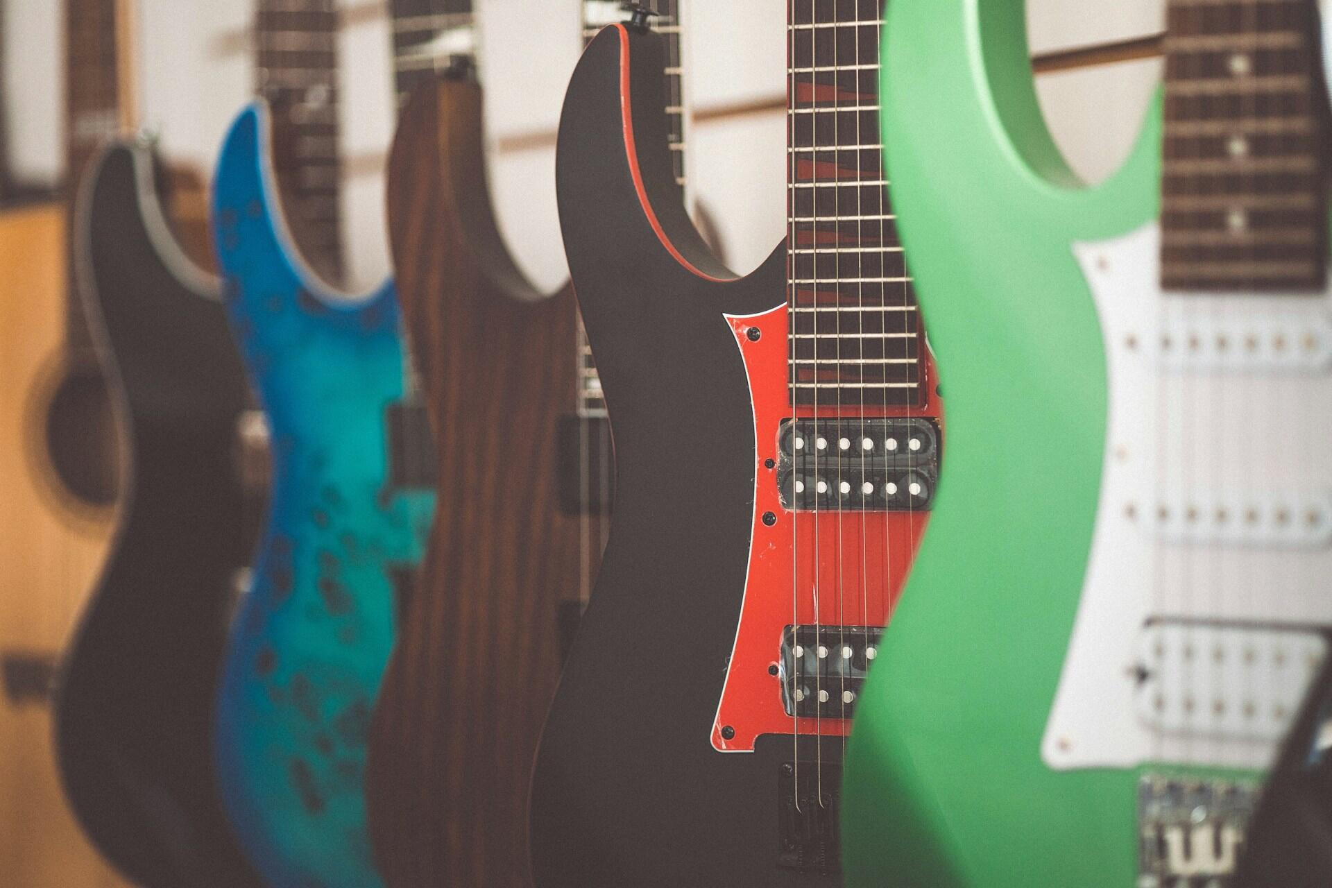 many bright electric guitars