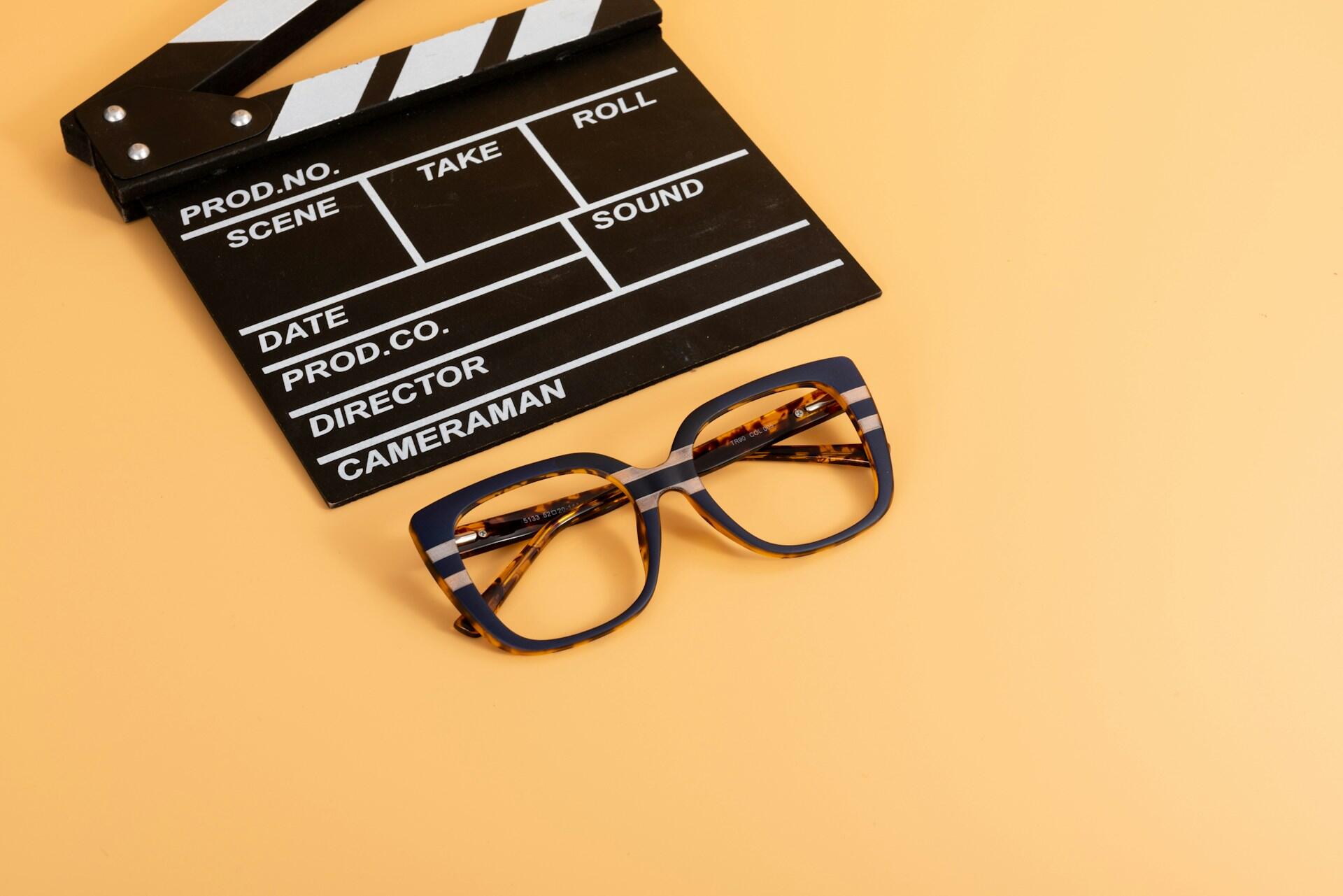 clapper board and glasses