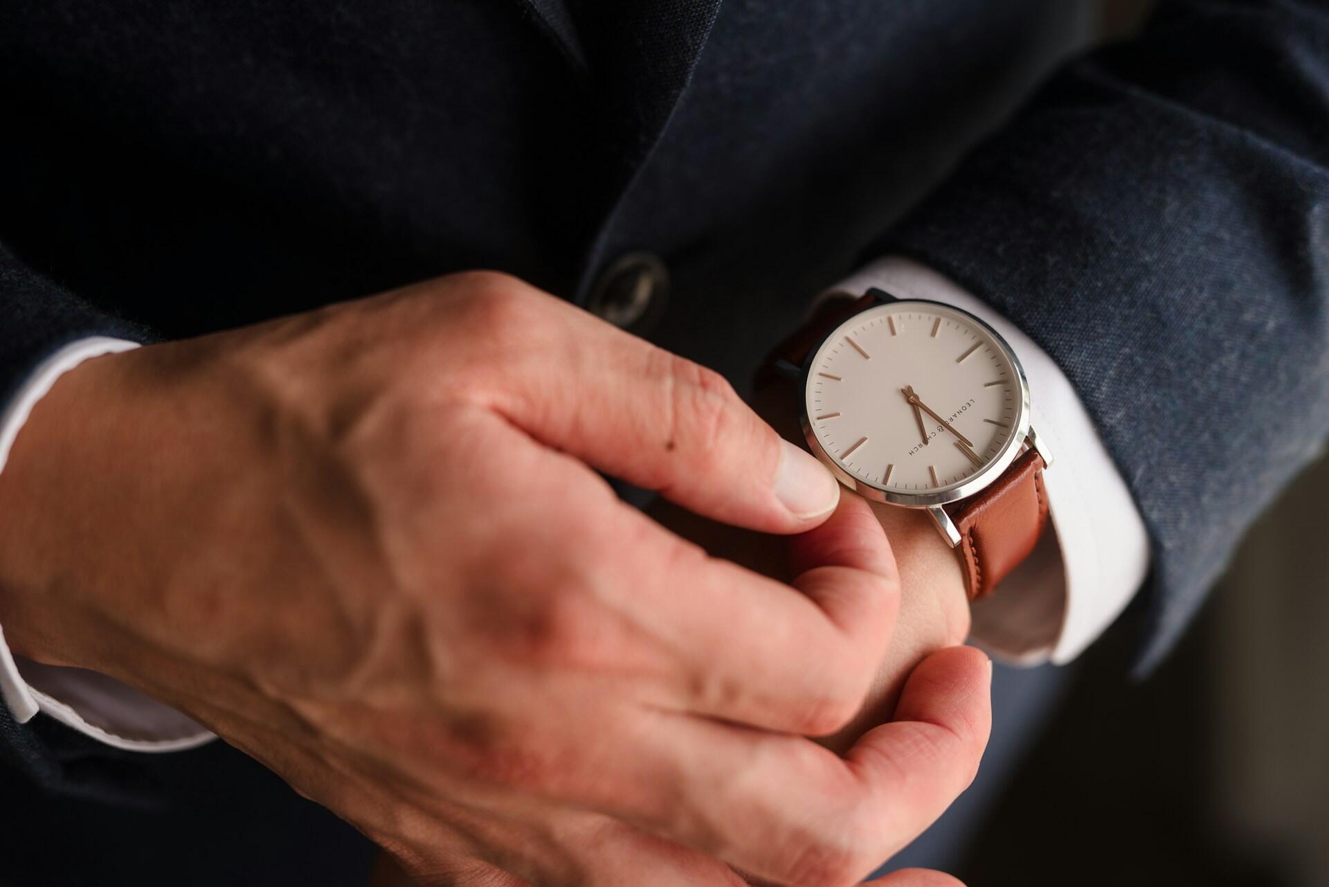 a male hand with a watch on it