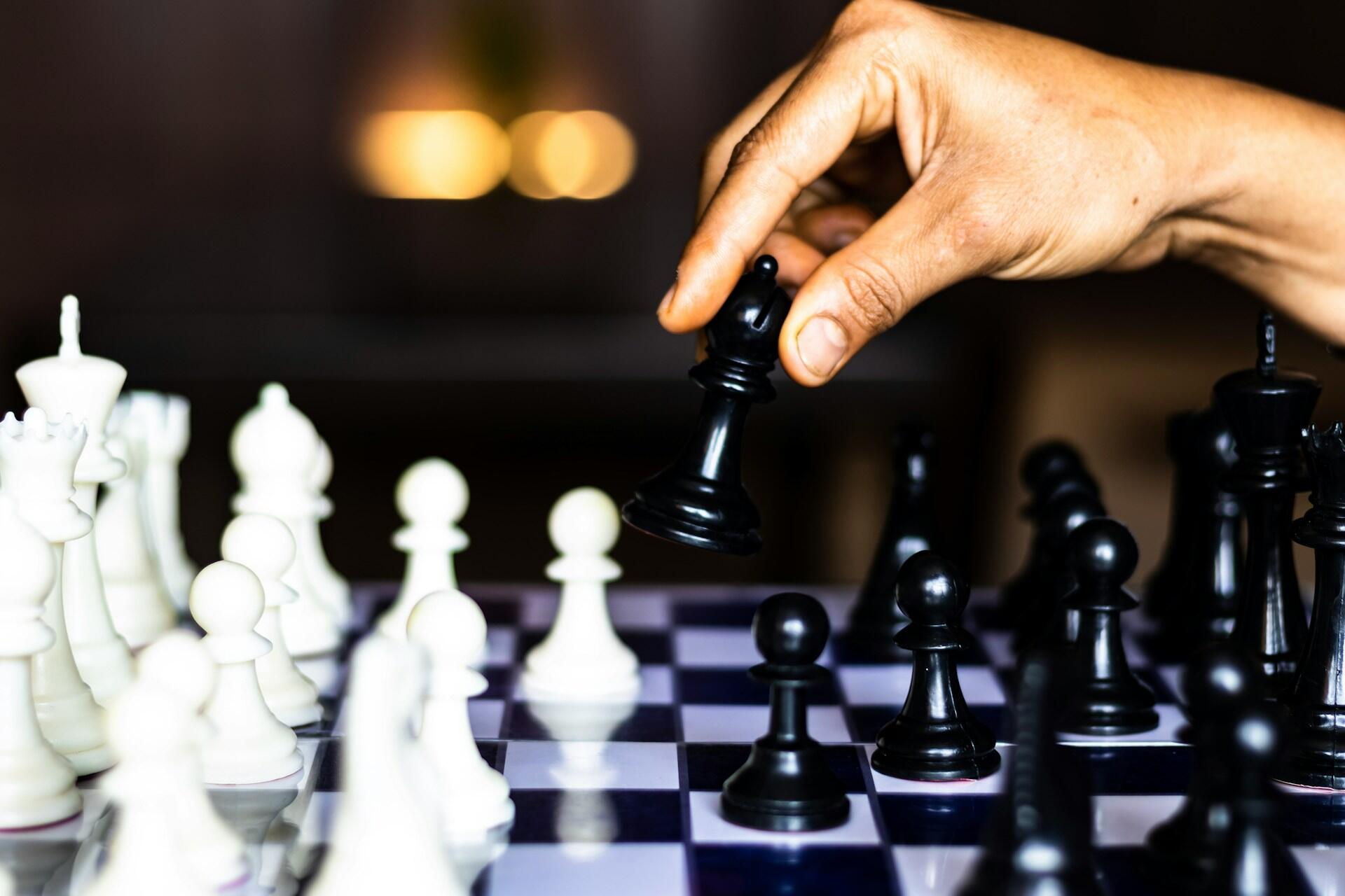 hand with a chess figure