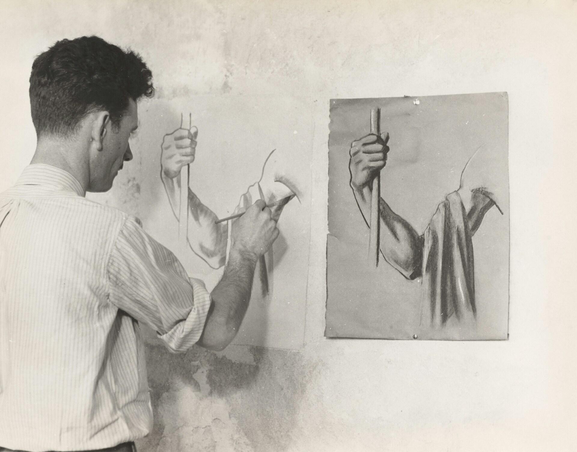 a man painter is painting on the wall