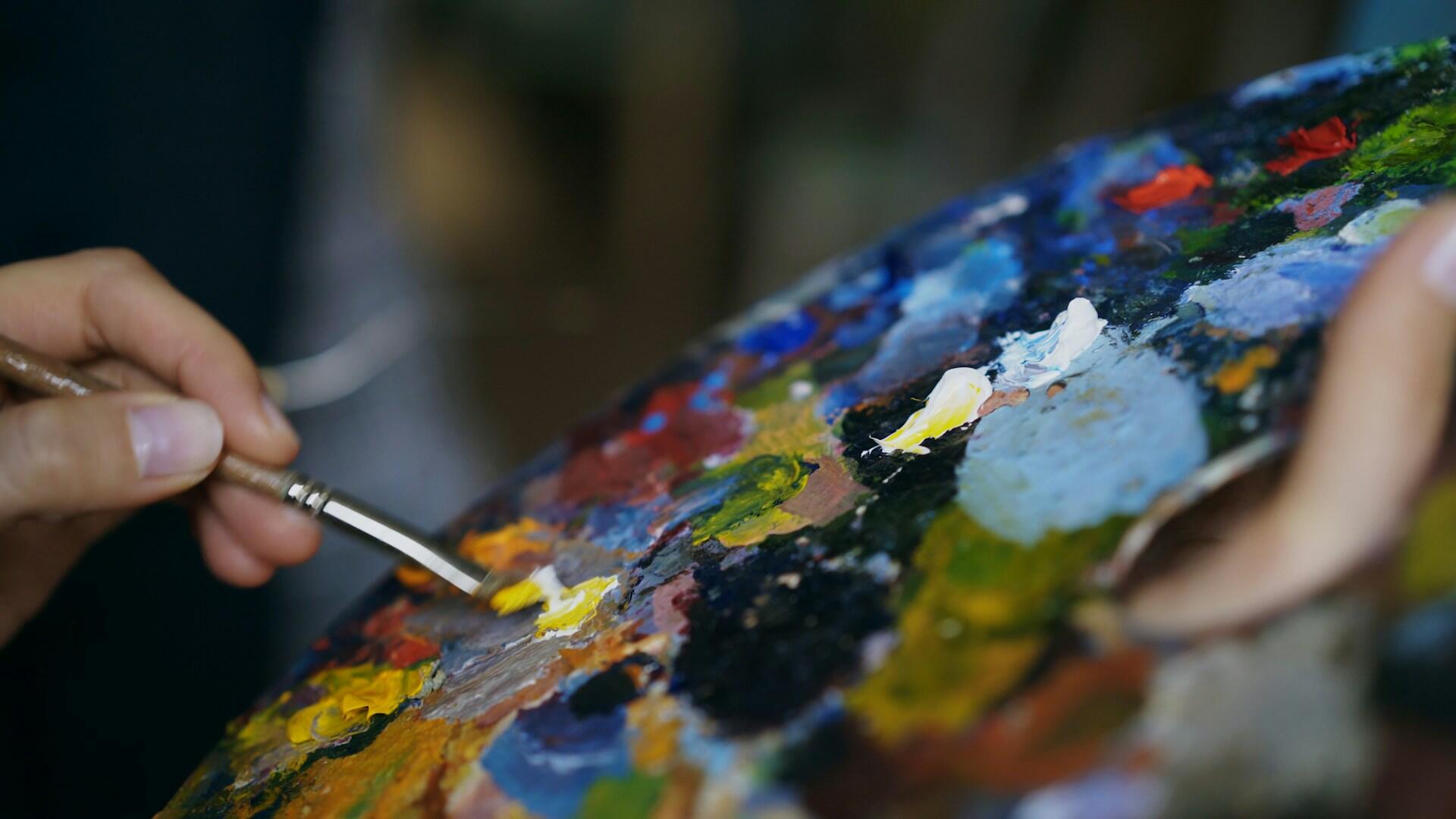 oil painting with a female hand