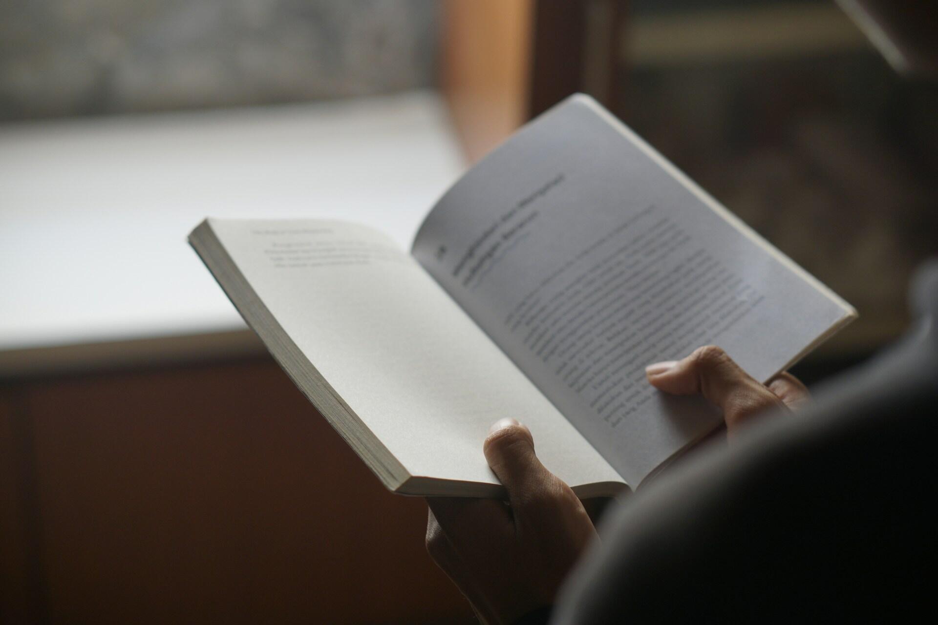 hands are holding a book