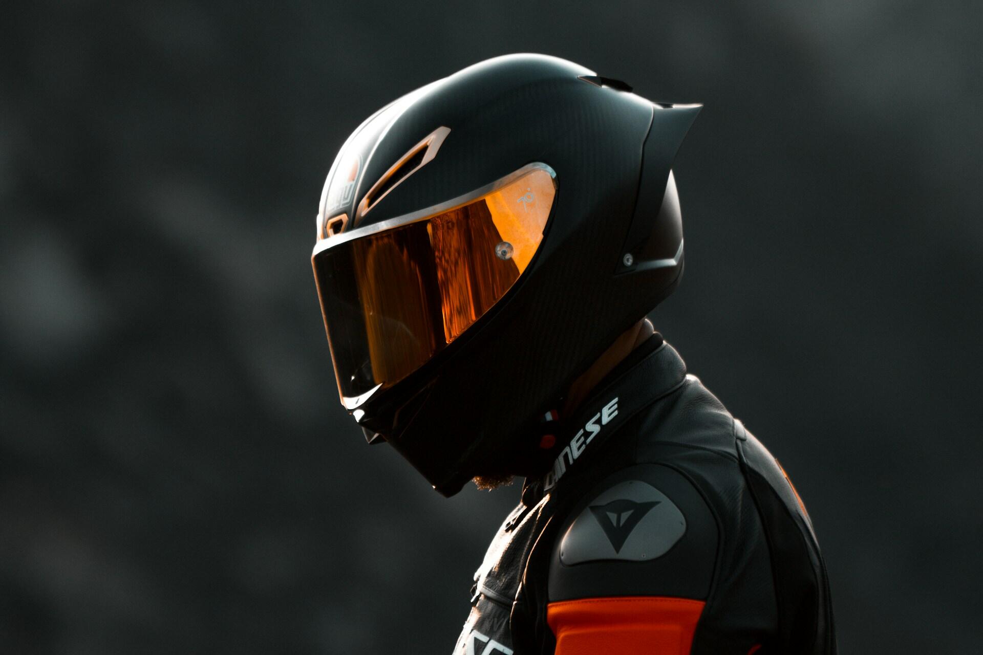 a man in the moto helmet