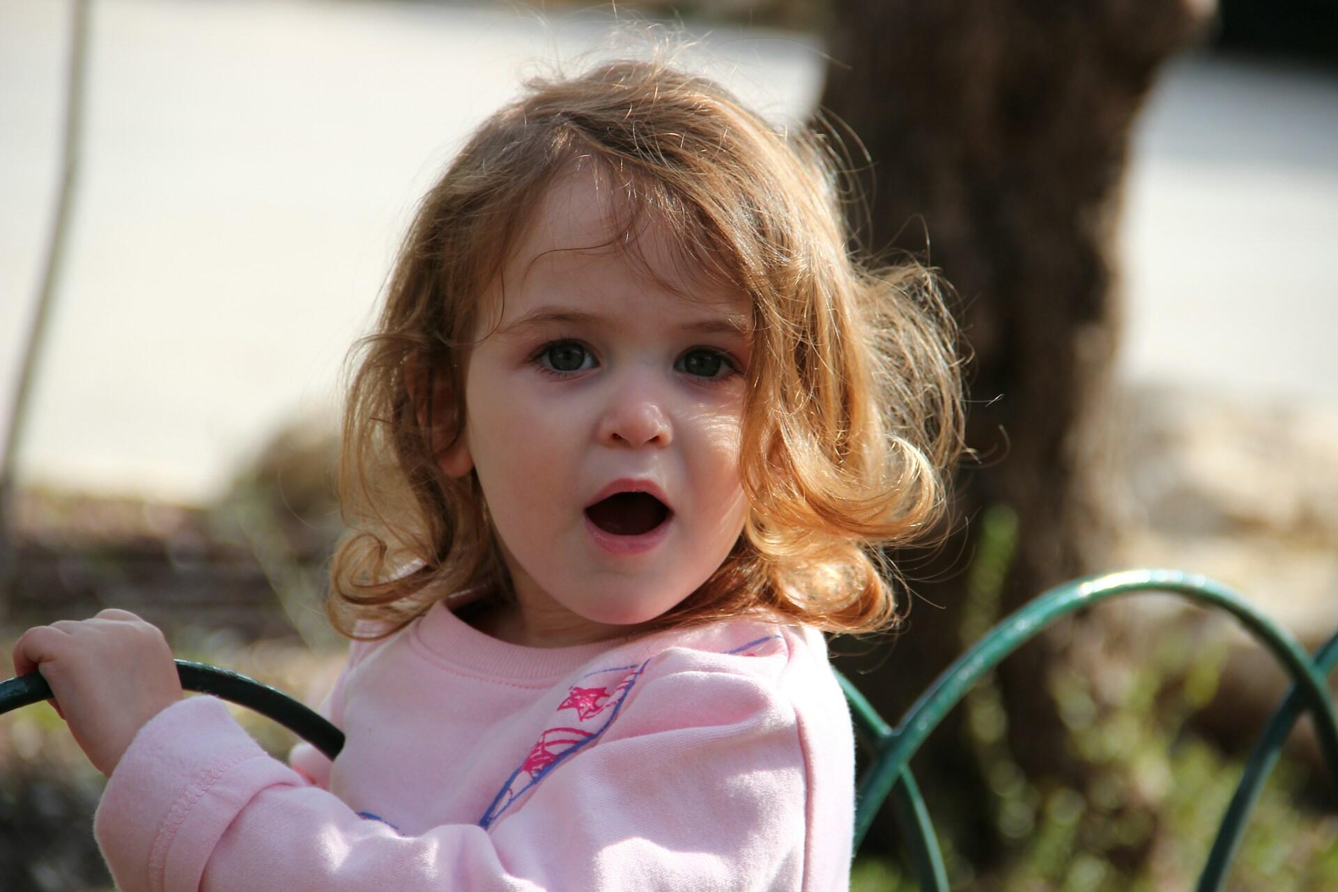 A small girl is surprised