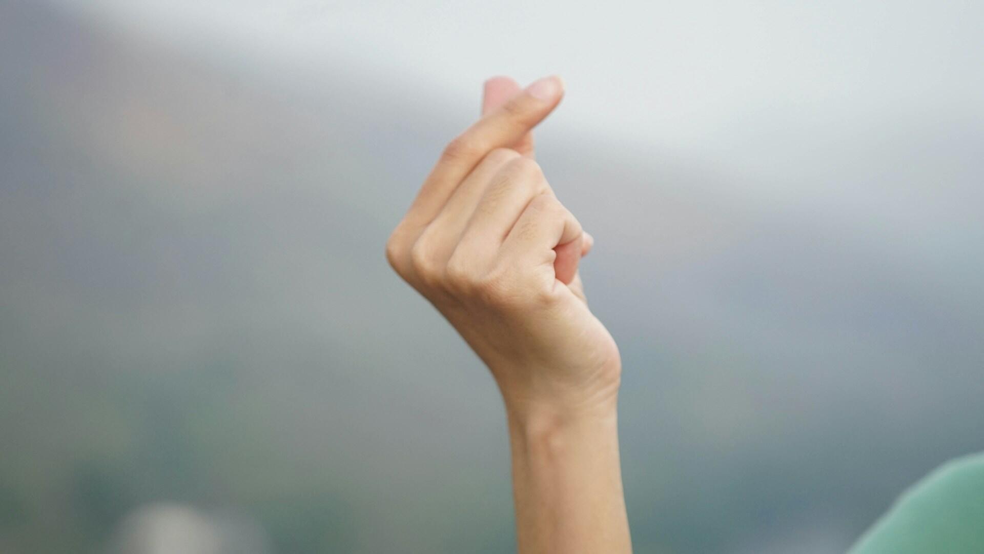 heart gesture made with fingers