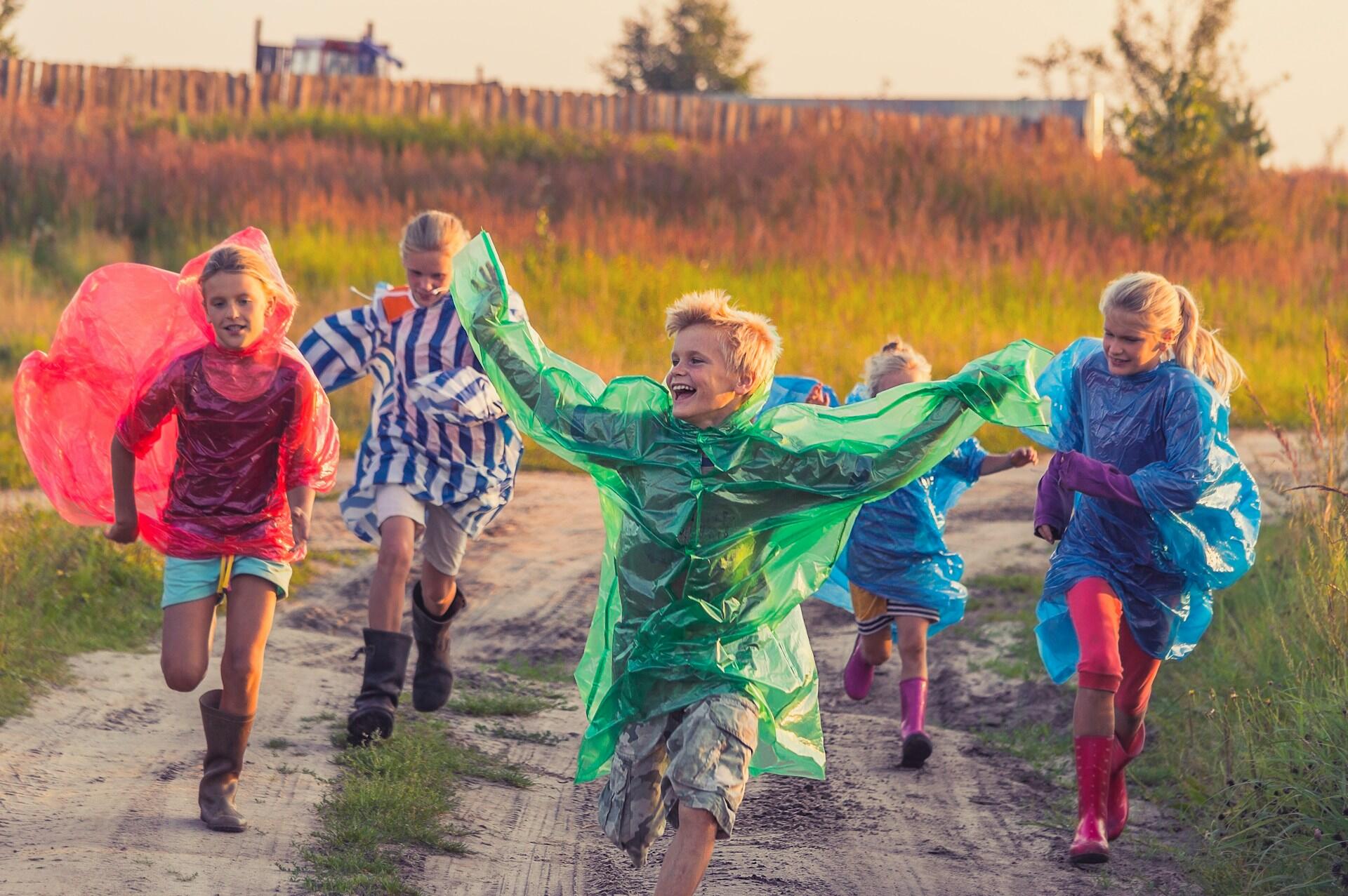 boys and girls in raincoats