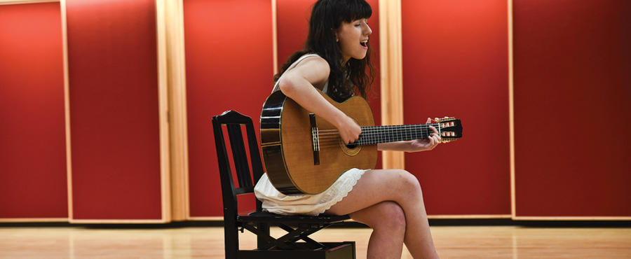 Go to a music school for guitar lessons