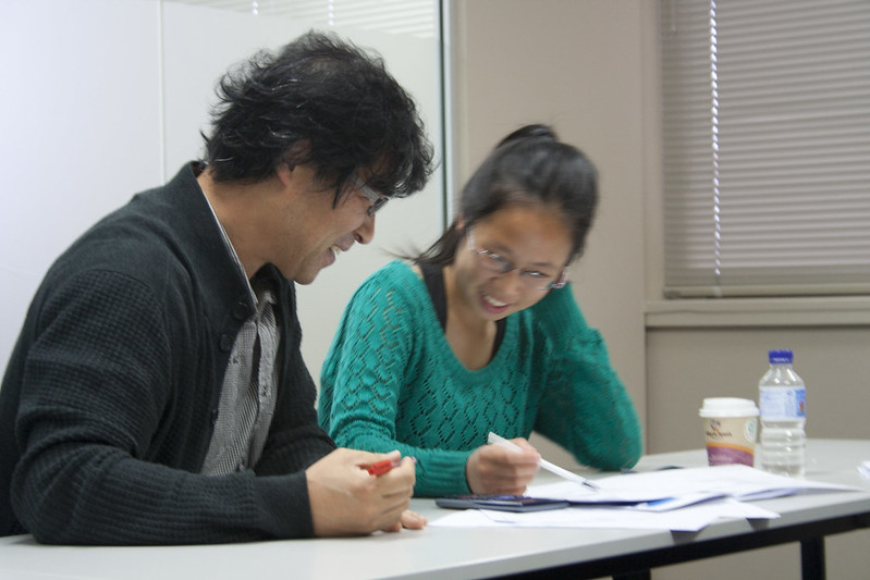 A tutor going over a concept with their student