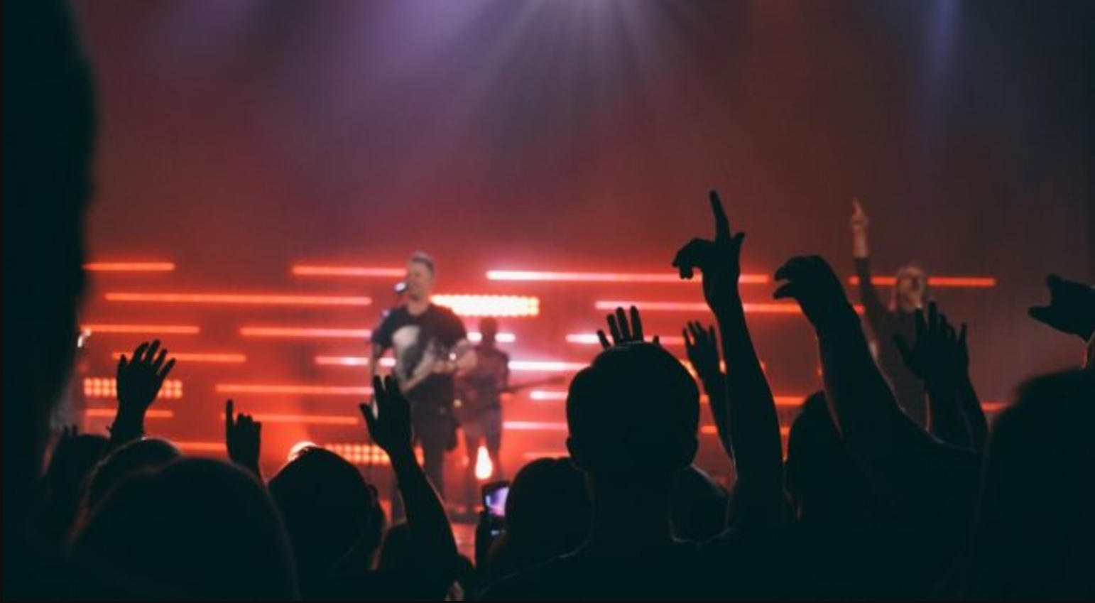 Play the guitar in concert with an instructor