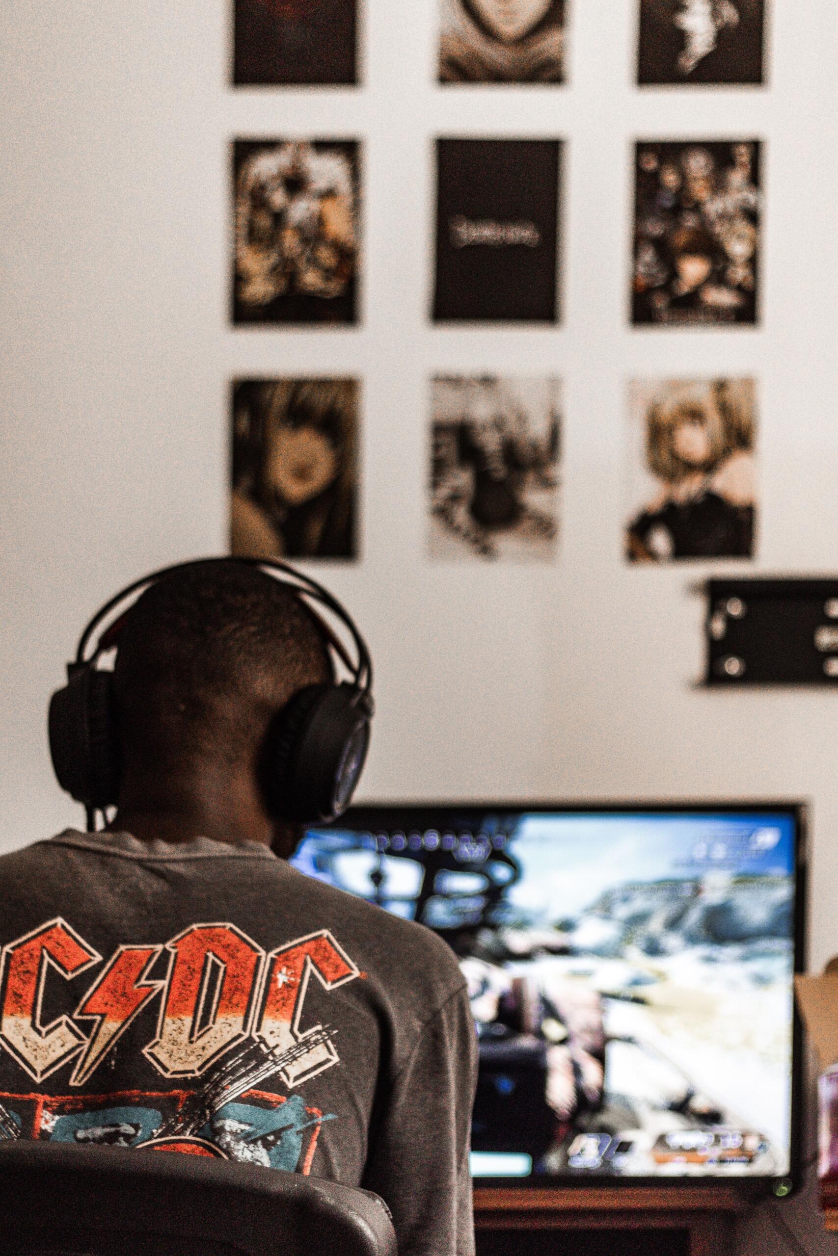 An ACDC fan is streaming their music on his computer at home