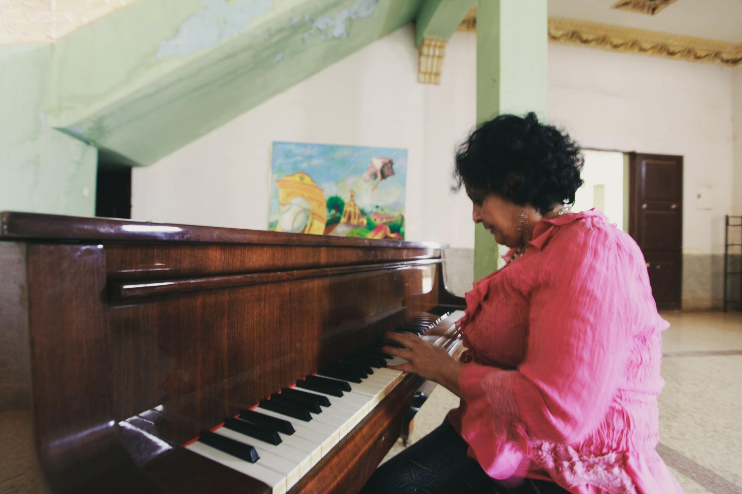 A musician trying out some challenging piano songs