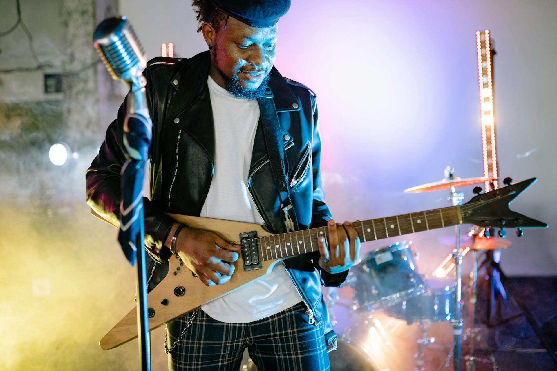 guitar player with "V" shaped electric guitar