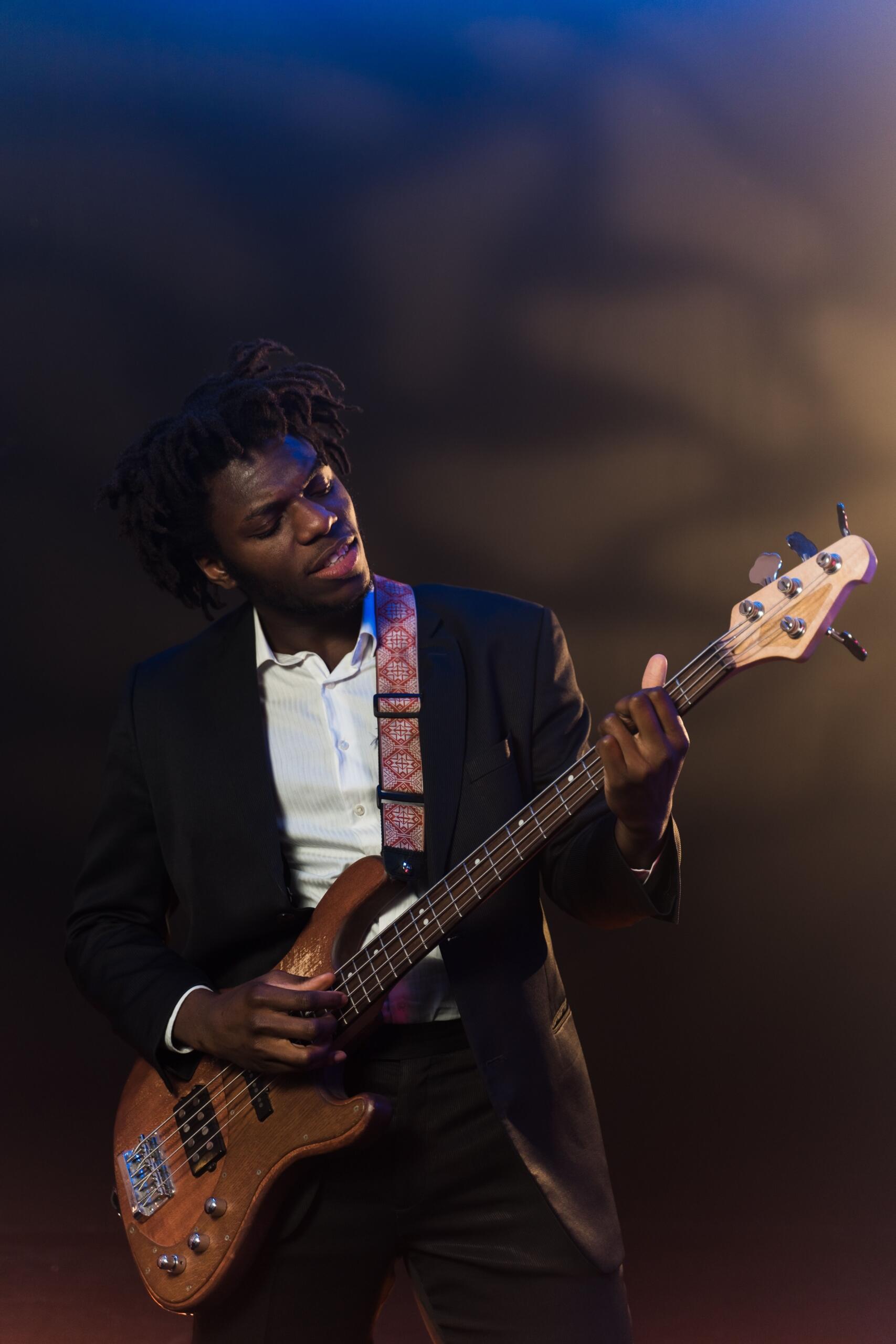 A guitar student is learning to play jazz music