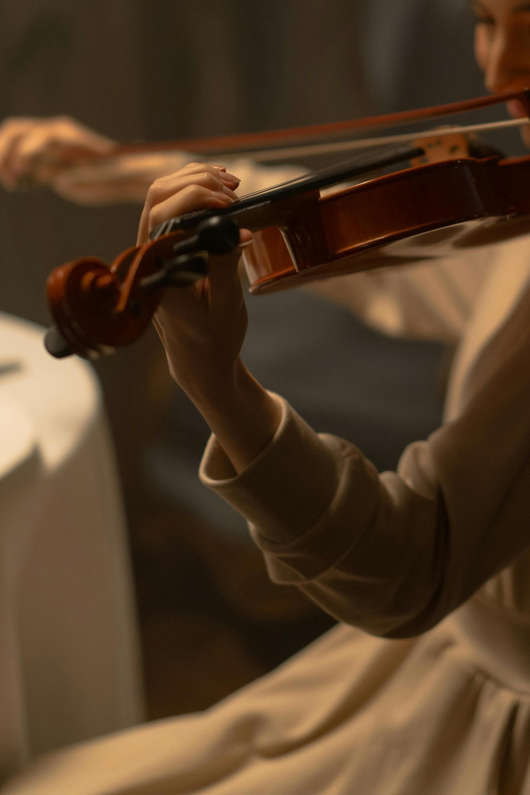 A violin student practicing finder placement in their lessons.