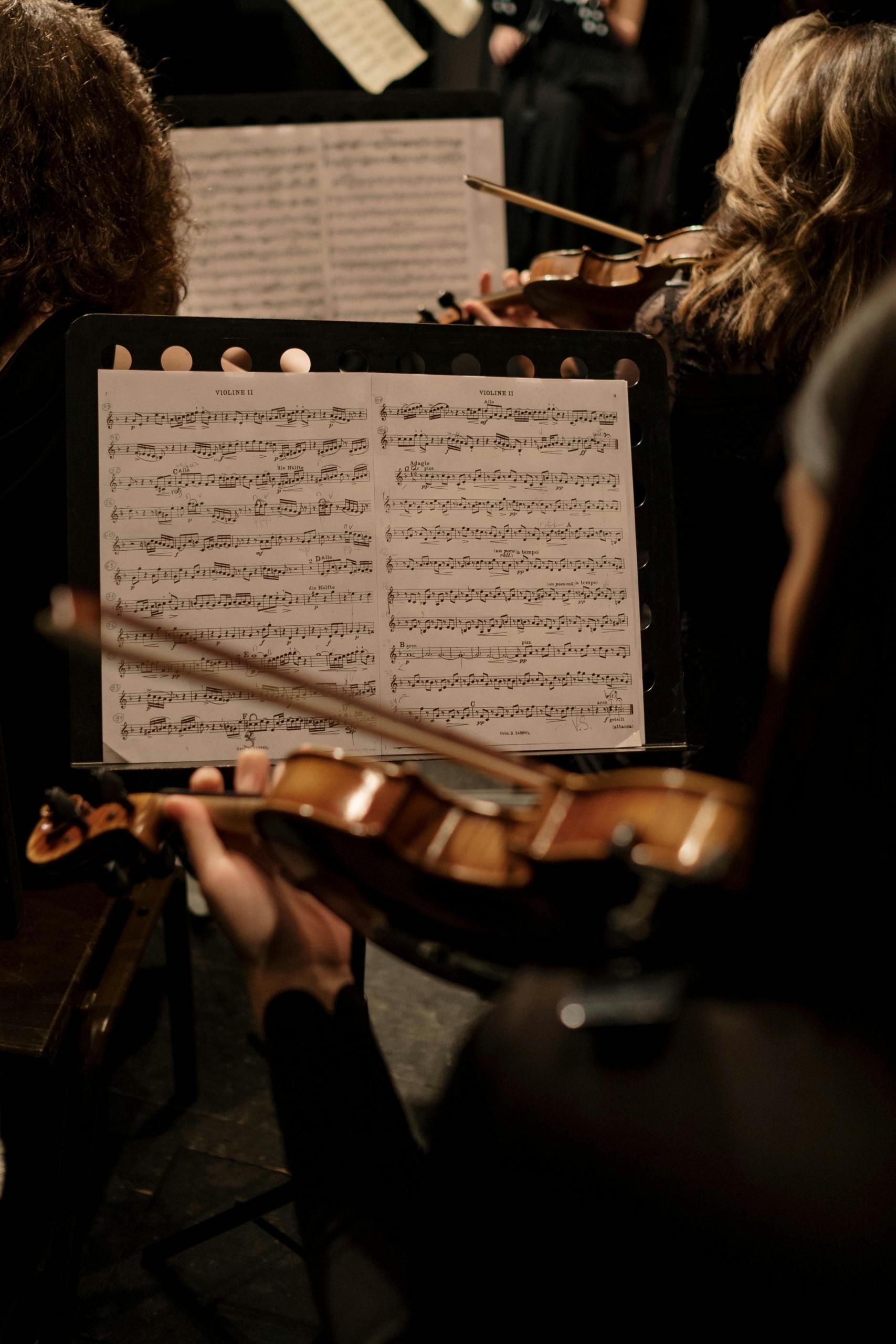 A violin class rehearsing a song.