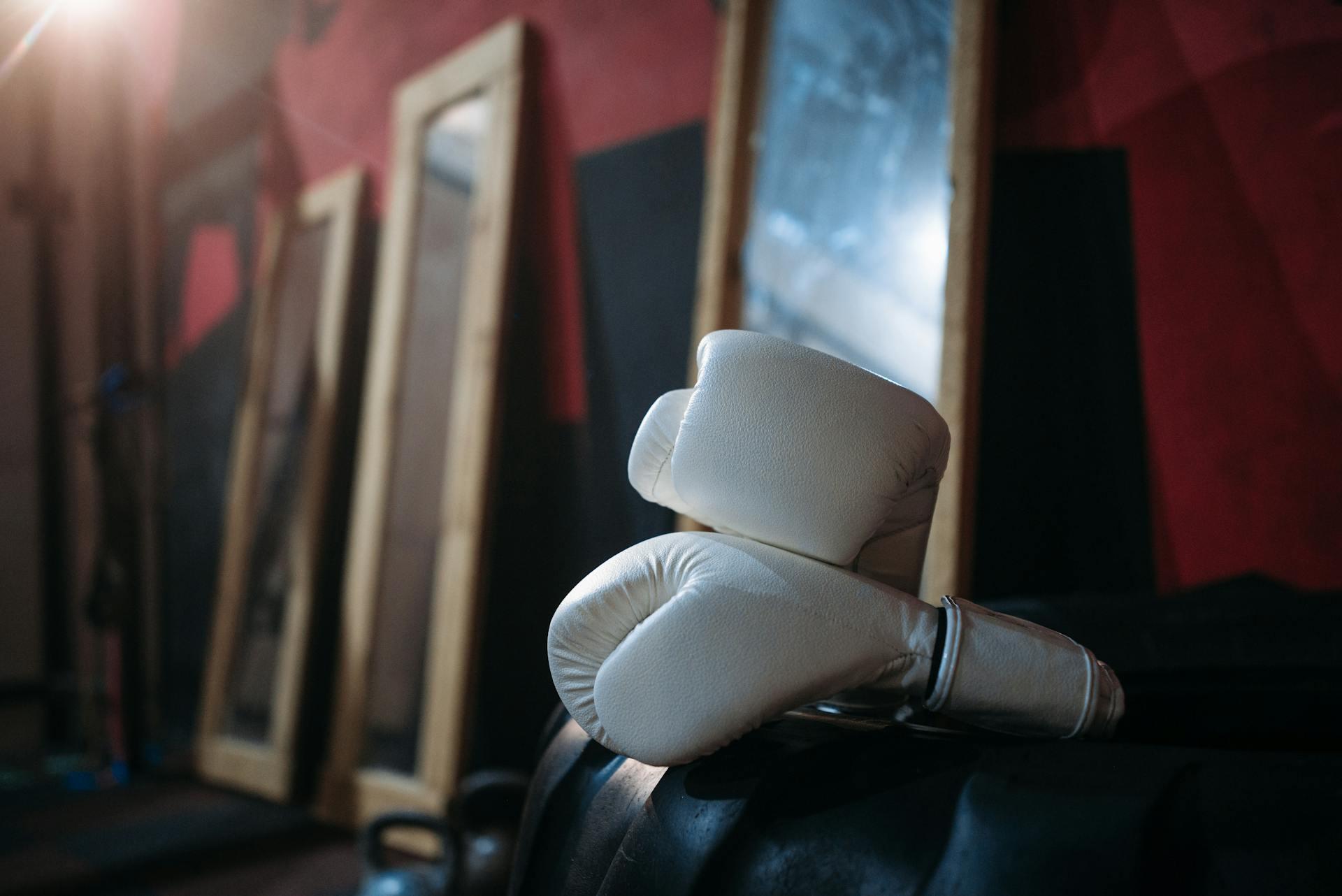 A pair of white boxing gloves.