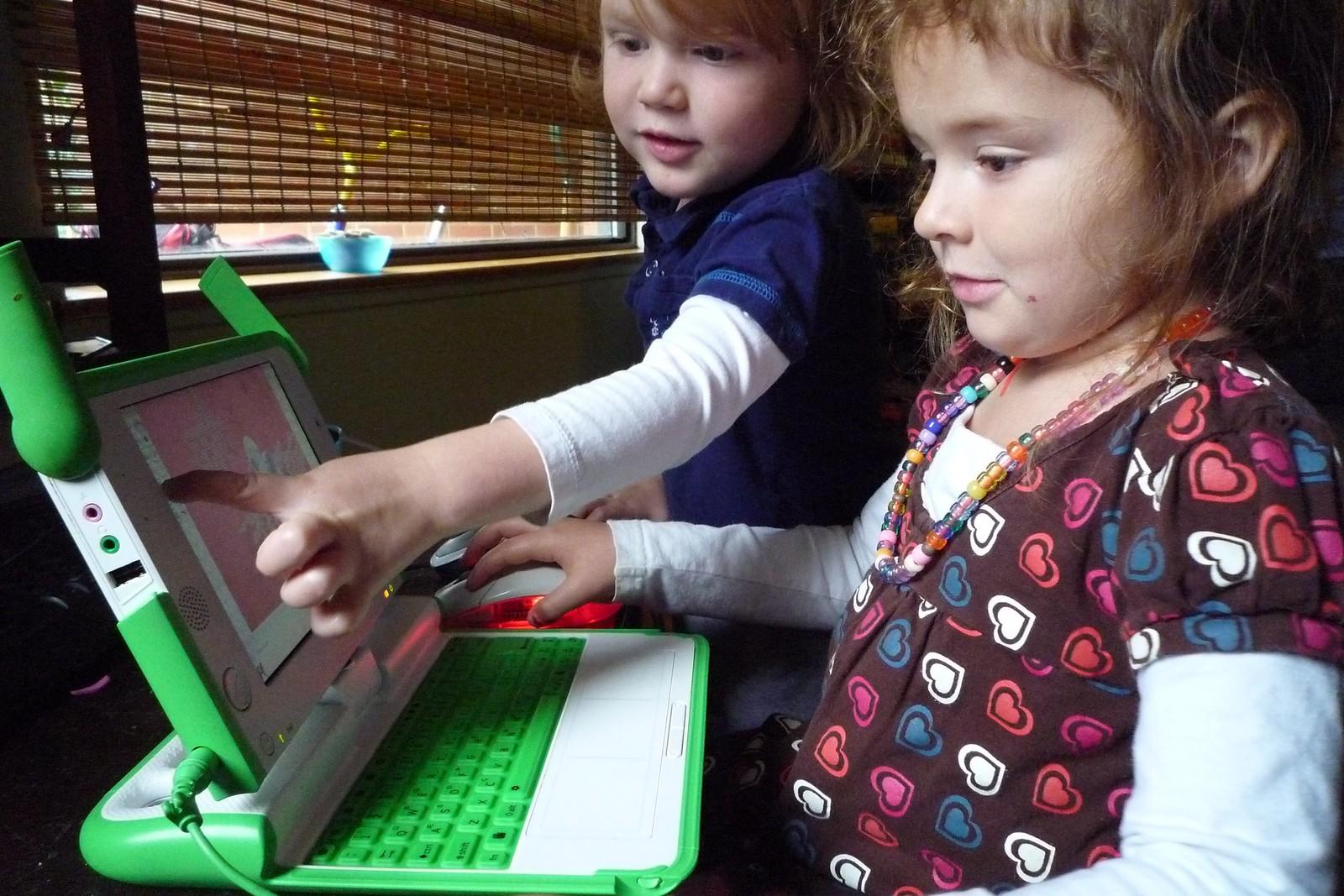 Two kids playing games on a children’s laptop. There are plenty of interactive math lessons online for kids as young as four, so you can use these resources to get your kids interested in math from an early age
