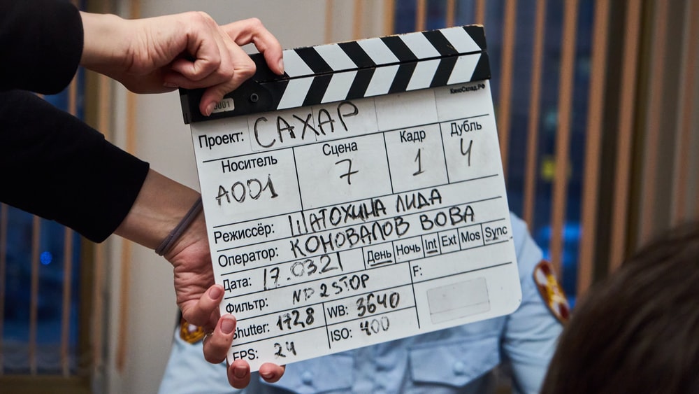 A movie clapboard is used to show details about the shot