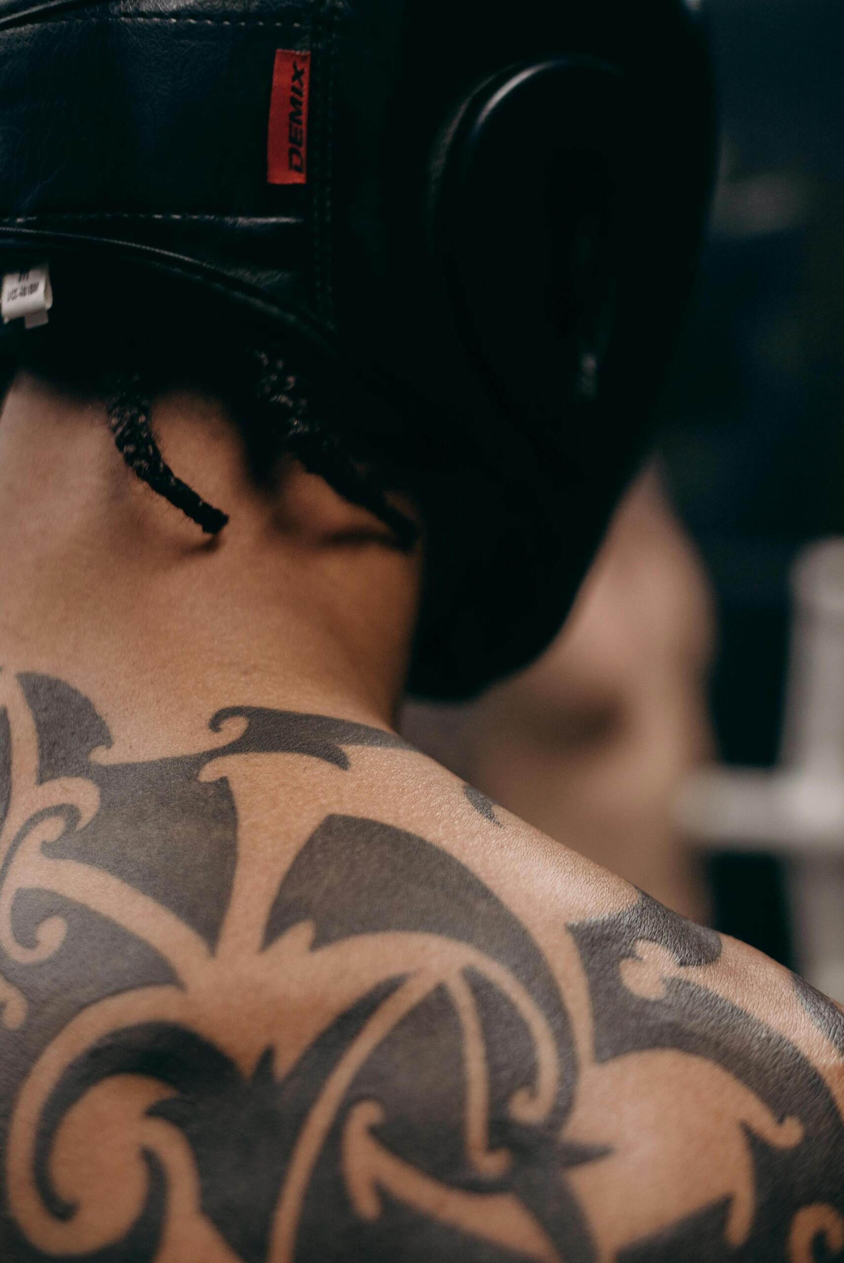 traditional style tattoos on display across a man's back
