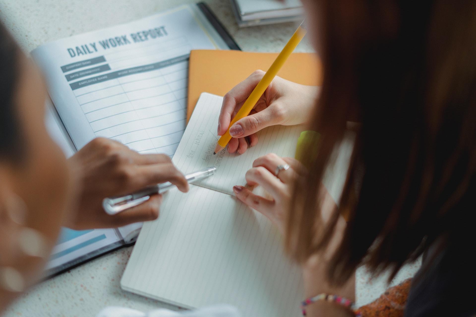two people writing