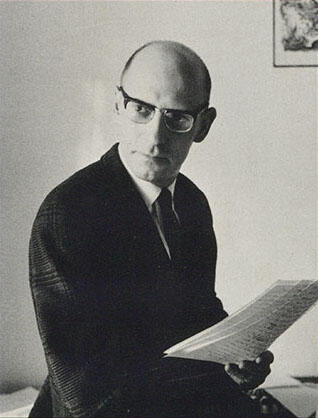 Michel Foucault reading a book.