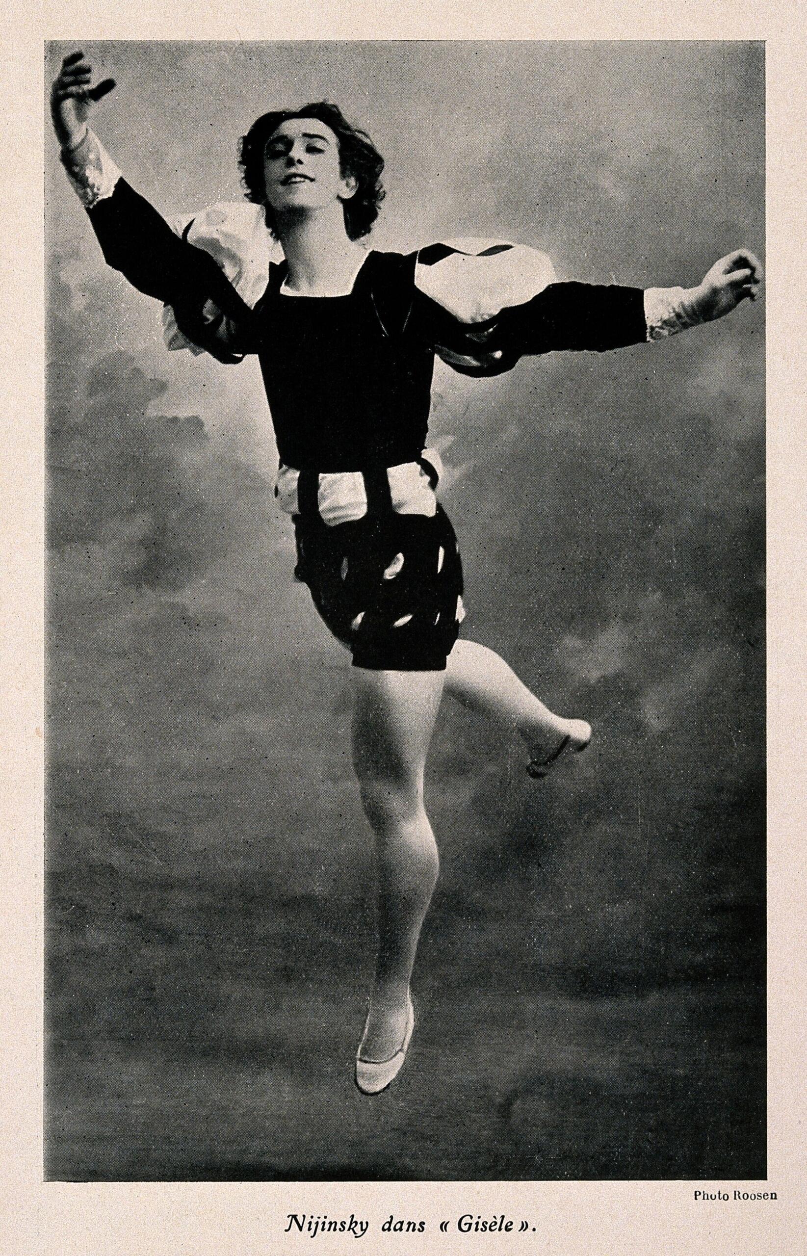 Vaslav Nijinsky jumping in a ballet costume.