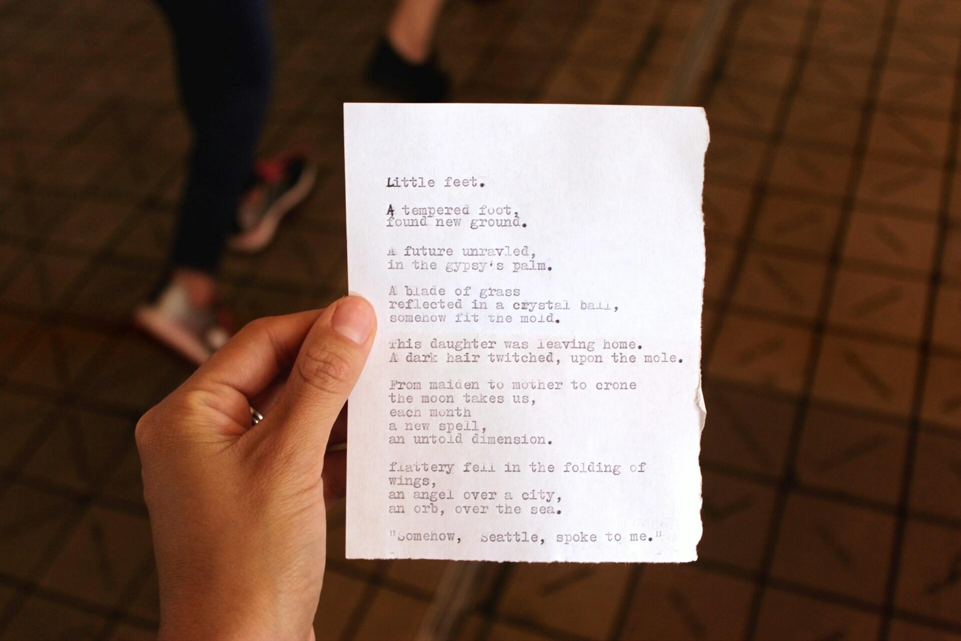 a poem typed with a typewriter on a slip of paper