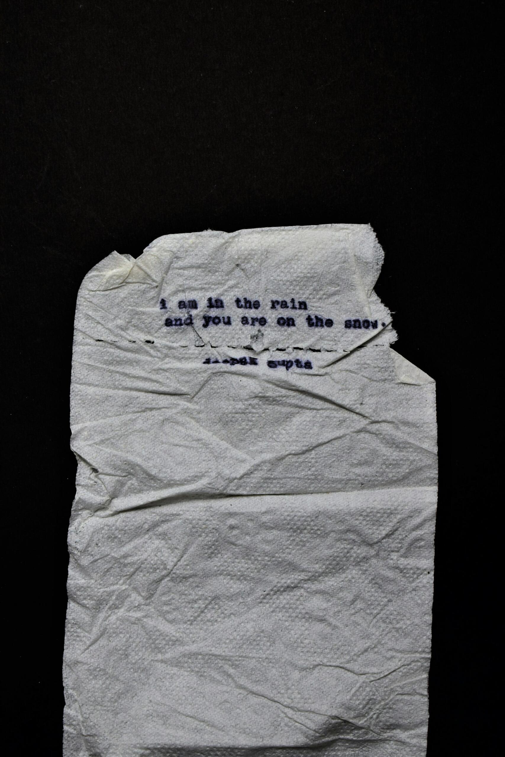 poem typed with a typewriter on a brown napkin