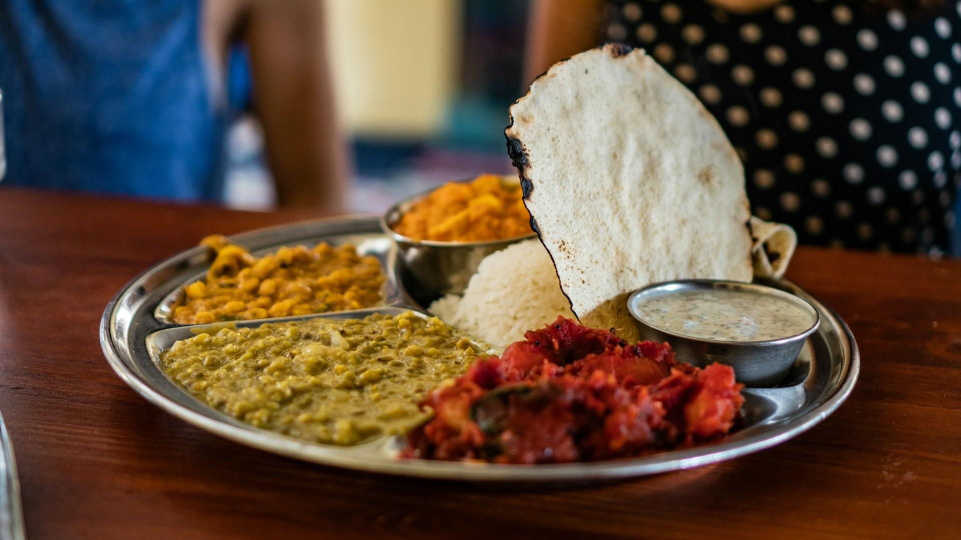 A colorful plate of Indian food.