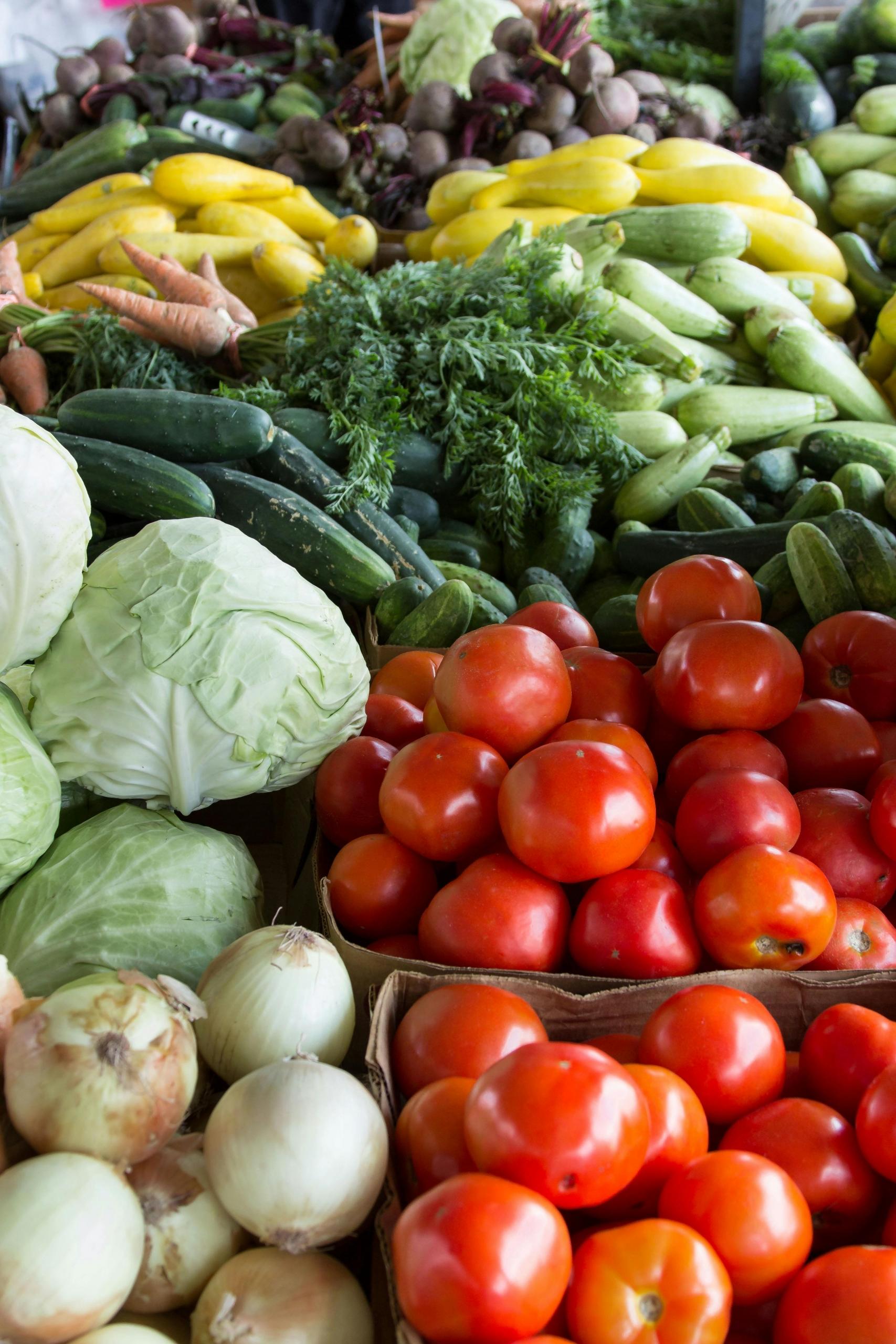 A market full of fresh vegetables and fruit.