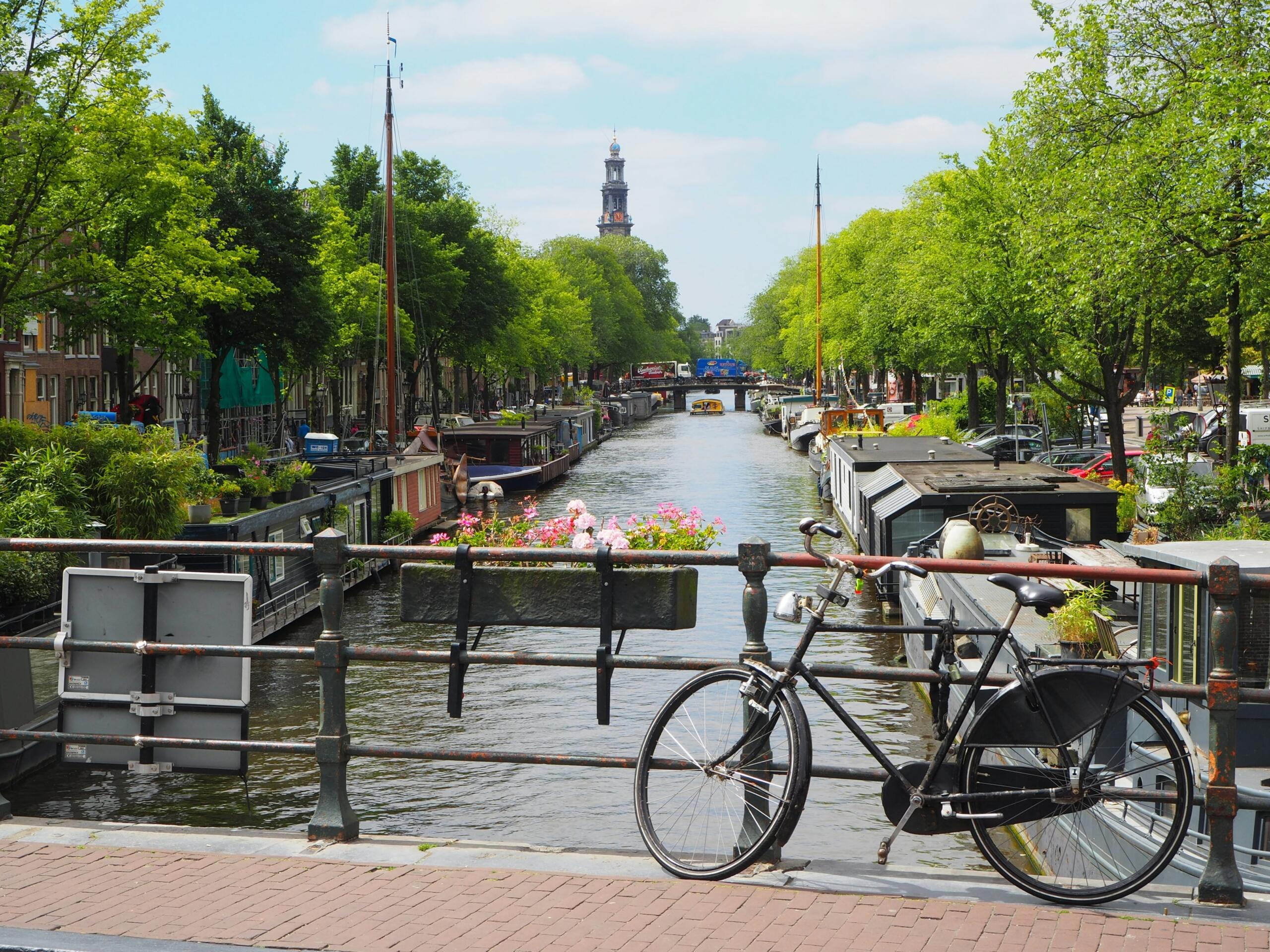 A bike on a bridge by a canal in the Netherlands.