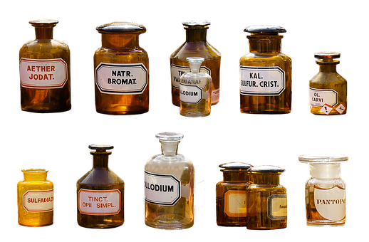 Two rows of glass jars with different chemical labels
