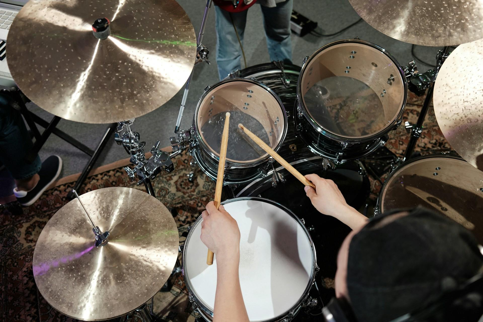 Someone playing on the drums.