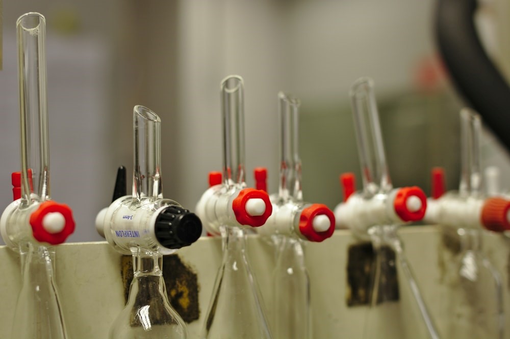 Several glass separating flasks lined up perfectly