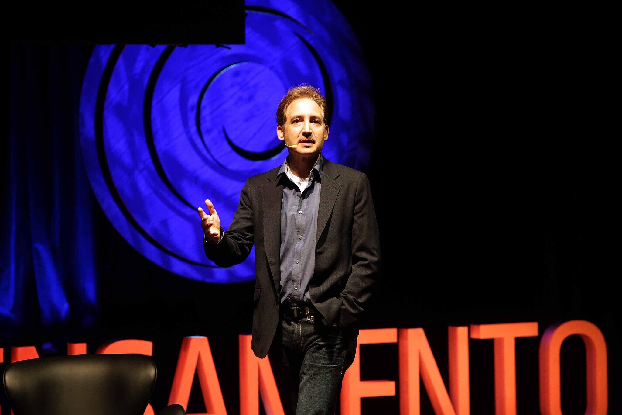 Brian Greene speaking at an event.