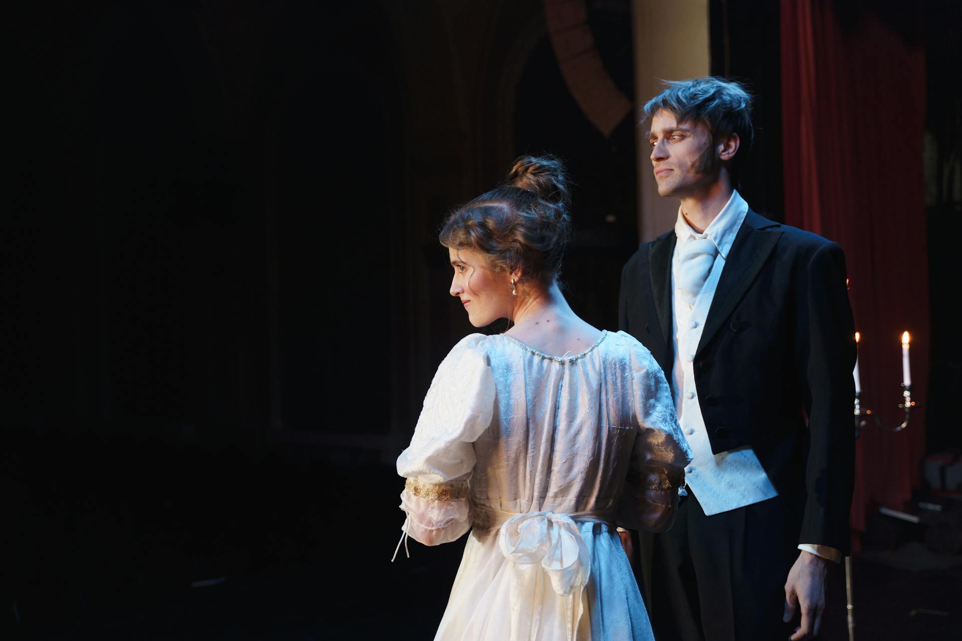 Two actors on stage during a performance.