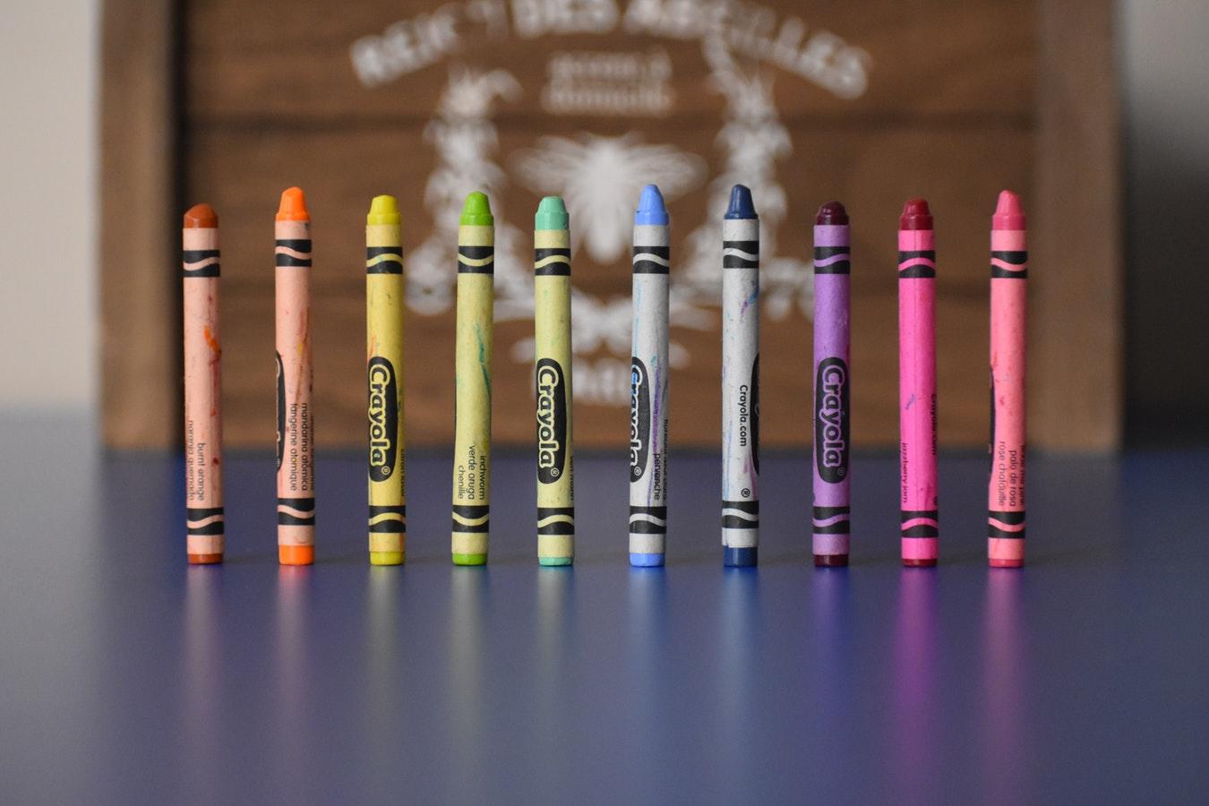 Colored crayons in a line