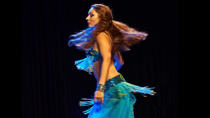 Woman in blue, bellydancing