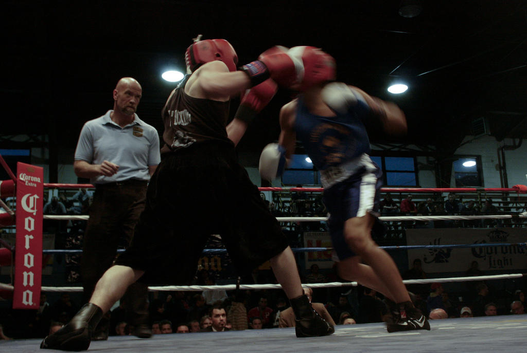 Referee looking on a boxing fight