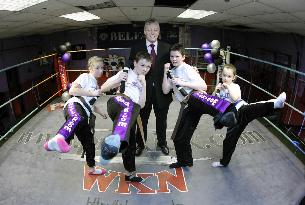 KIds posing for a photograph in a boxing ring