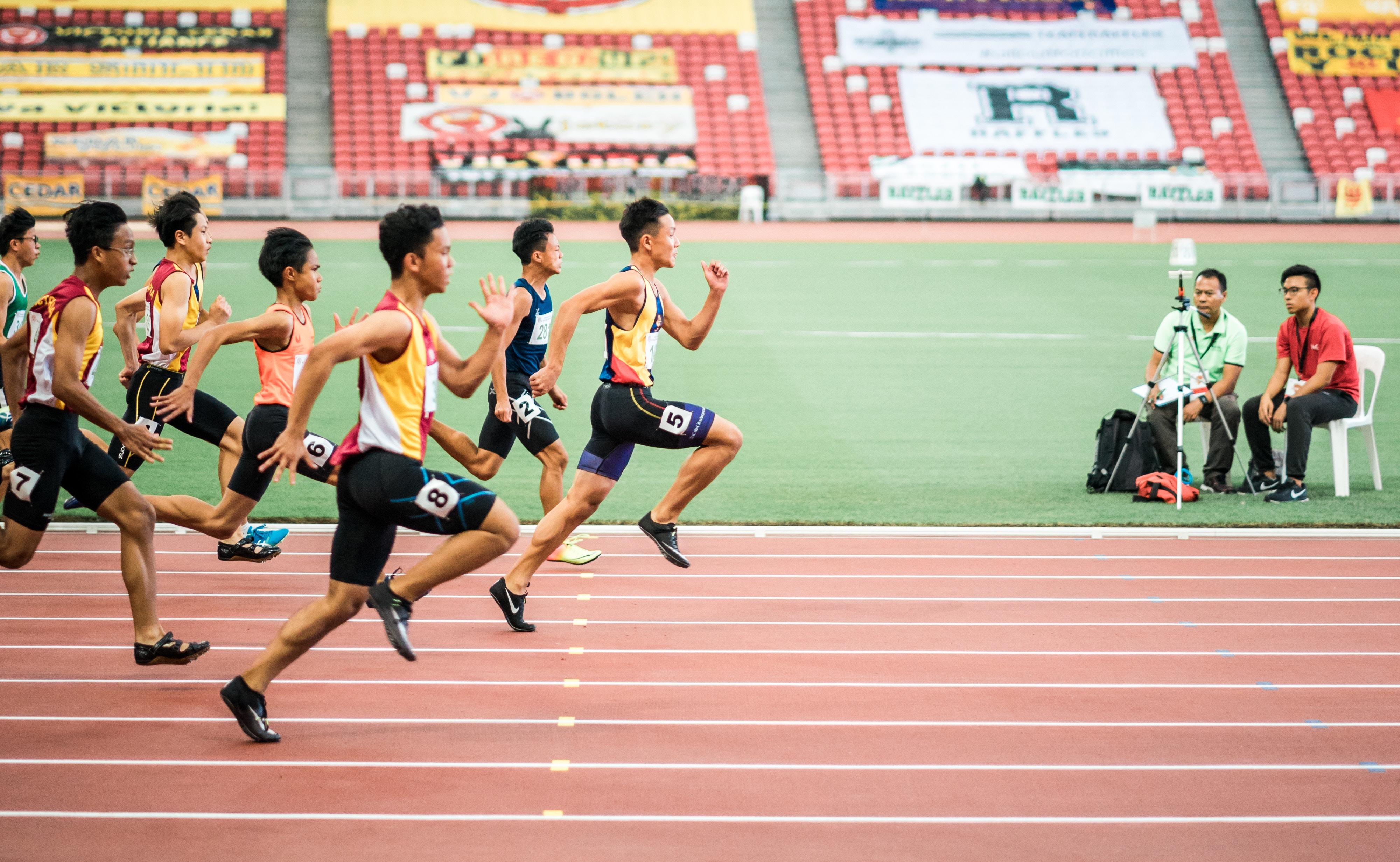 Runners running a race on an athletics track
