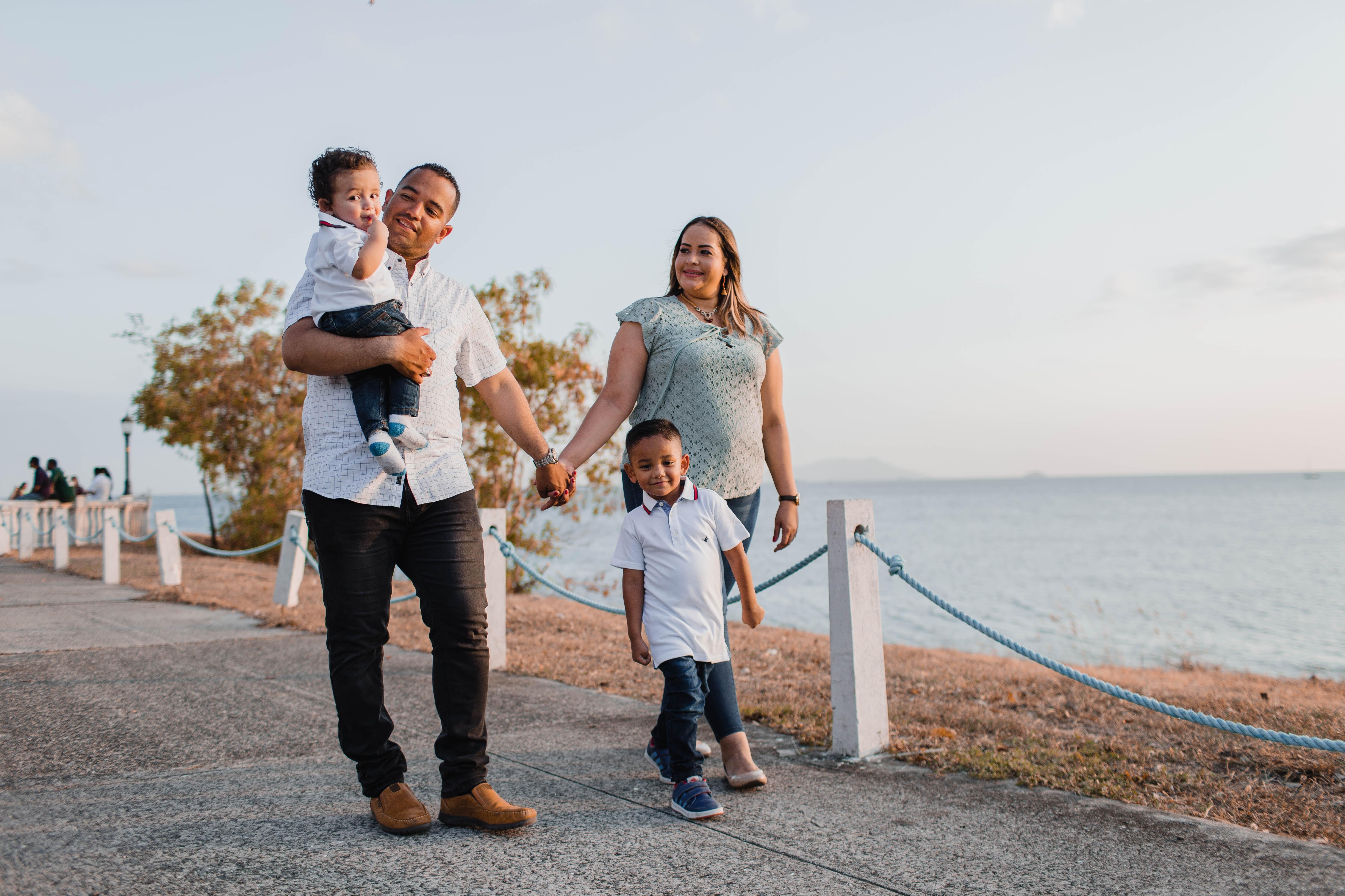 family walking near water