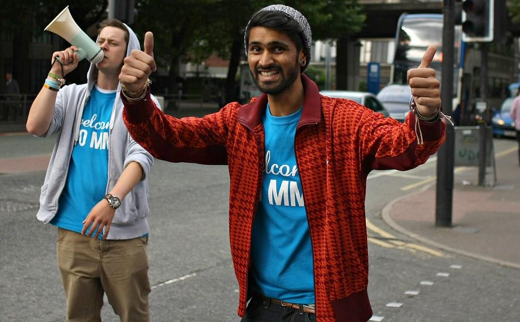 Two students welcome freshmen to their university