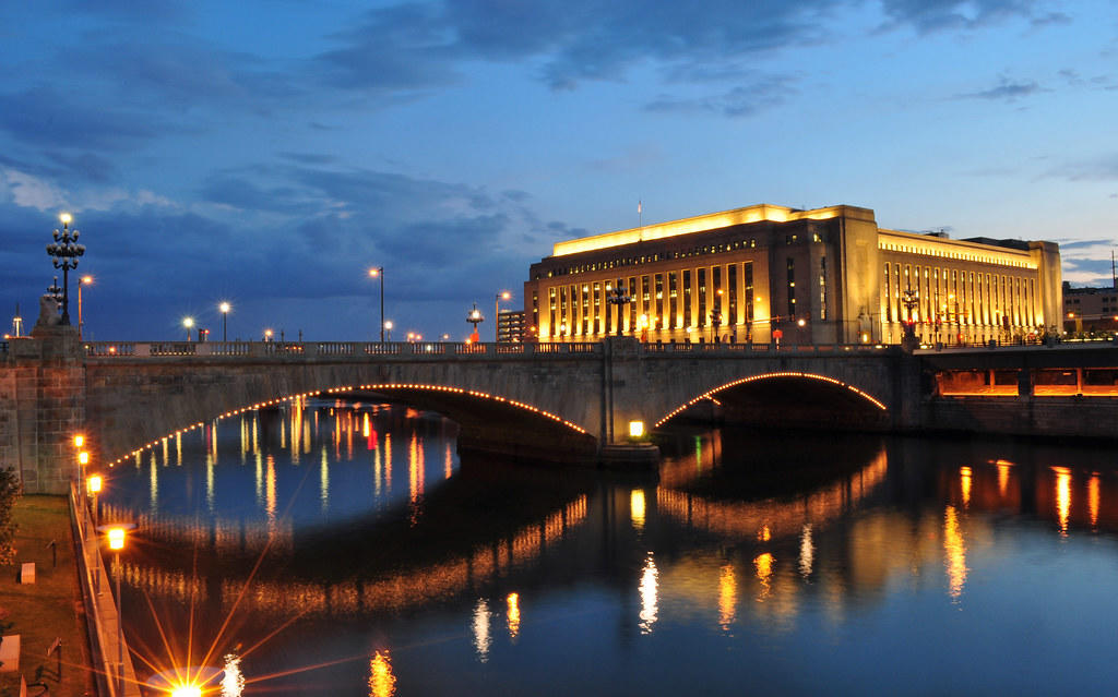 A bridge stays lit up during the evening.
