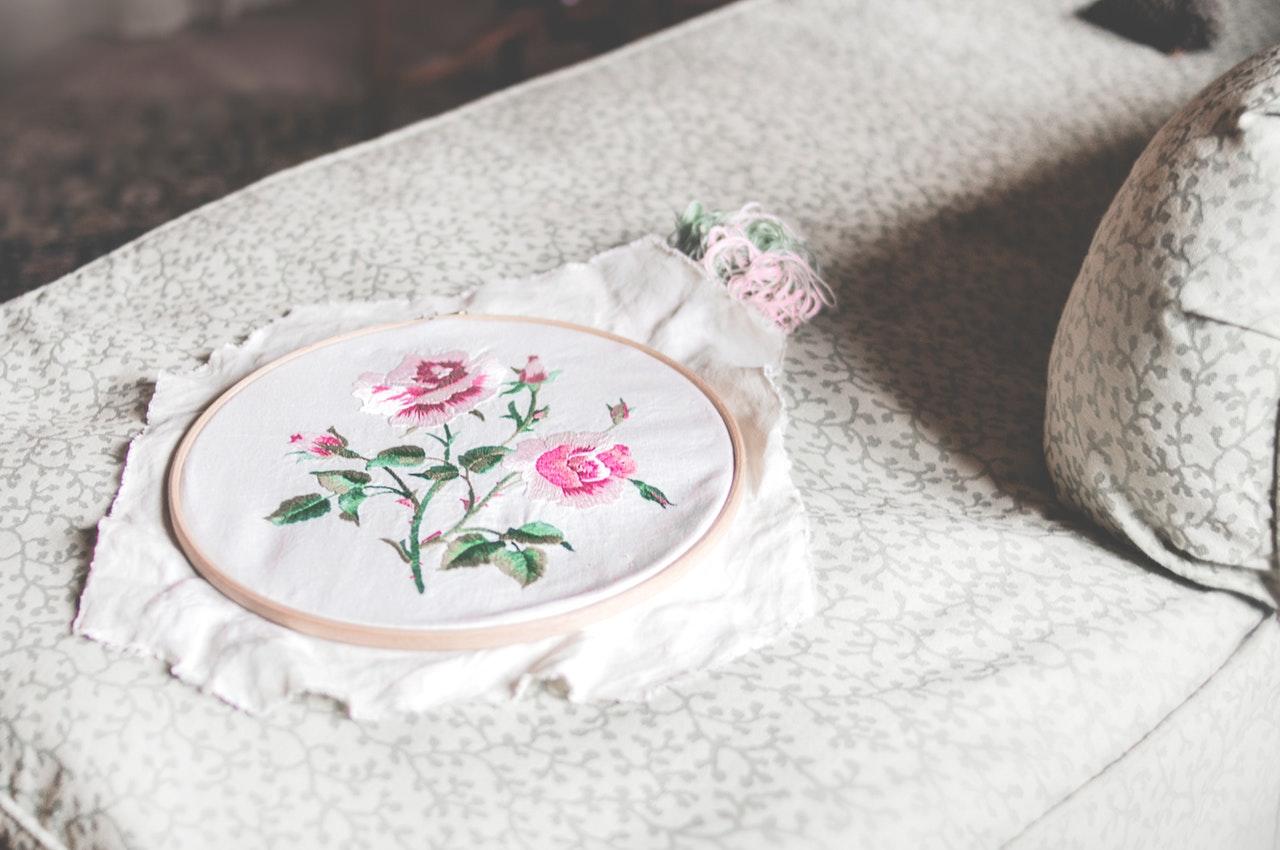 Embroidered flowers on white thread.
