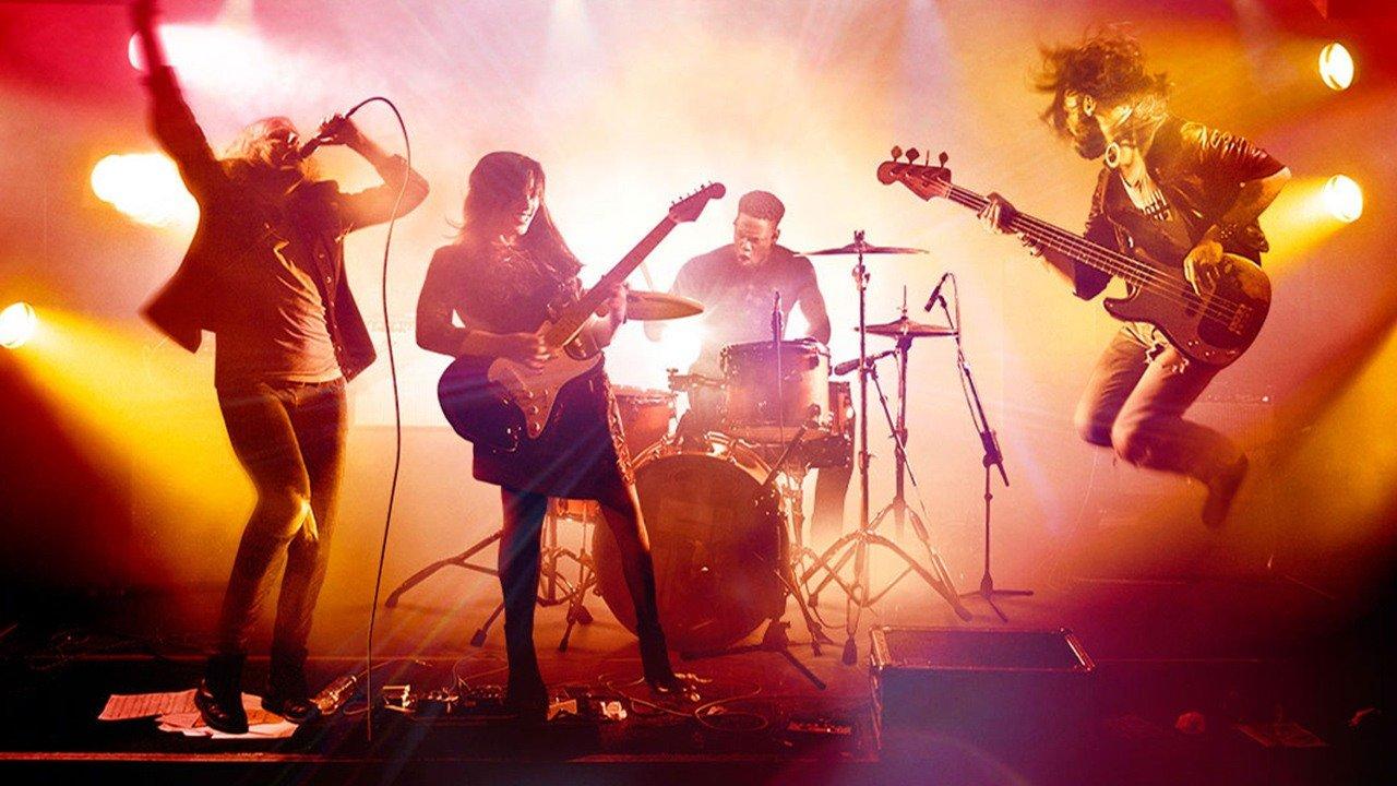 A rock band performing with various musical instruments
