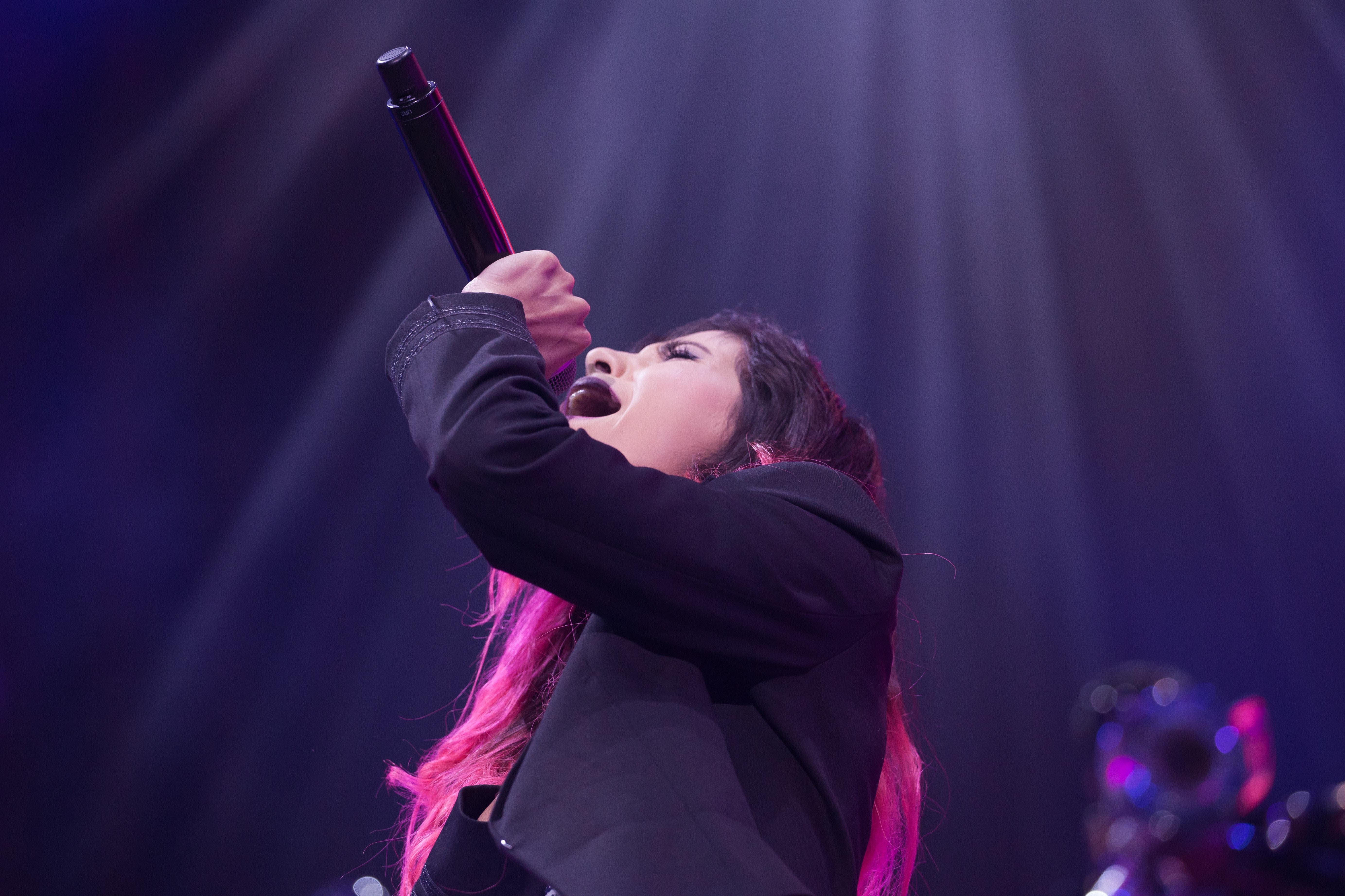 Woman on stage sining